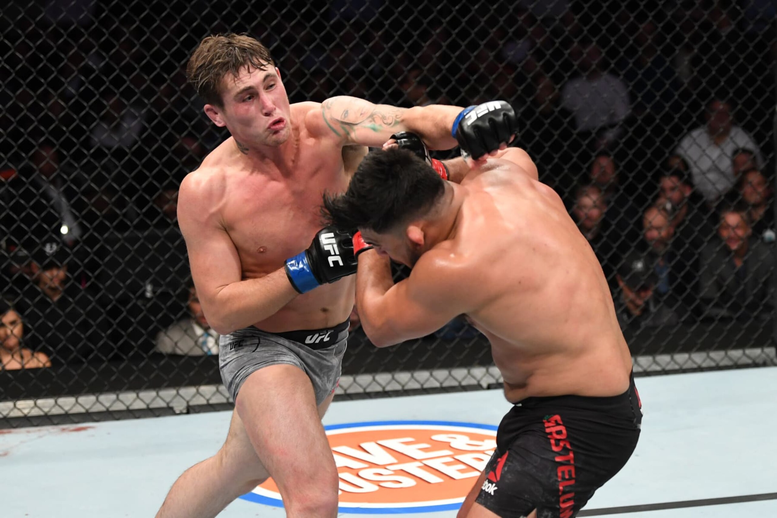 NEW YORK, NEW YORK - NOVEMBER 02: (L-R) Darren Till of England punches Kelvin Gastelum in their middleweight bout during the UFC 244 event at Madison Square Garden on November 02, 2019 in New York City. (Photo by Josh Hedges/Zuffa LLC via Getty Images)