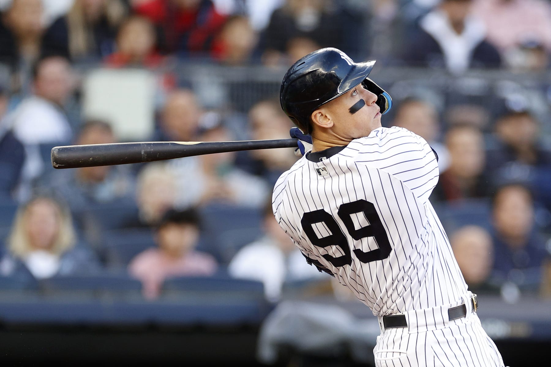 NEW YORK, NEW YORK - OCTOBER 18: Aaron Judge #99 of the New York Yankees hits a home run against the Cleveland Guardians during the second inning in game five of the American League Division Series at Yankee Stadium on October 18, 2022 in New York, New York. (Photo by Sarah Stier/Getty Images)
