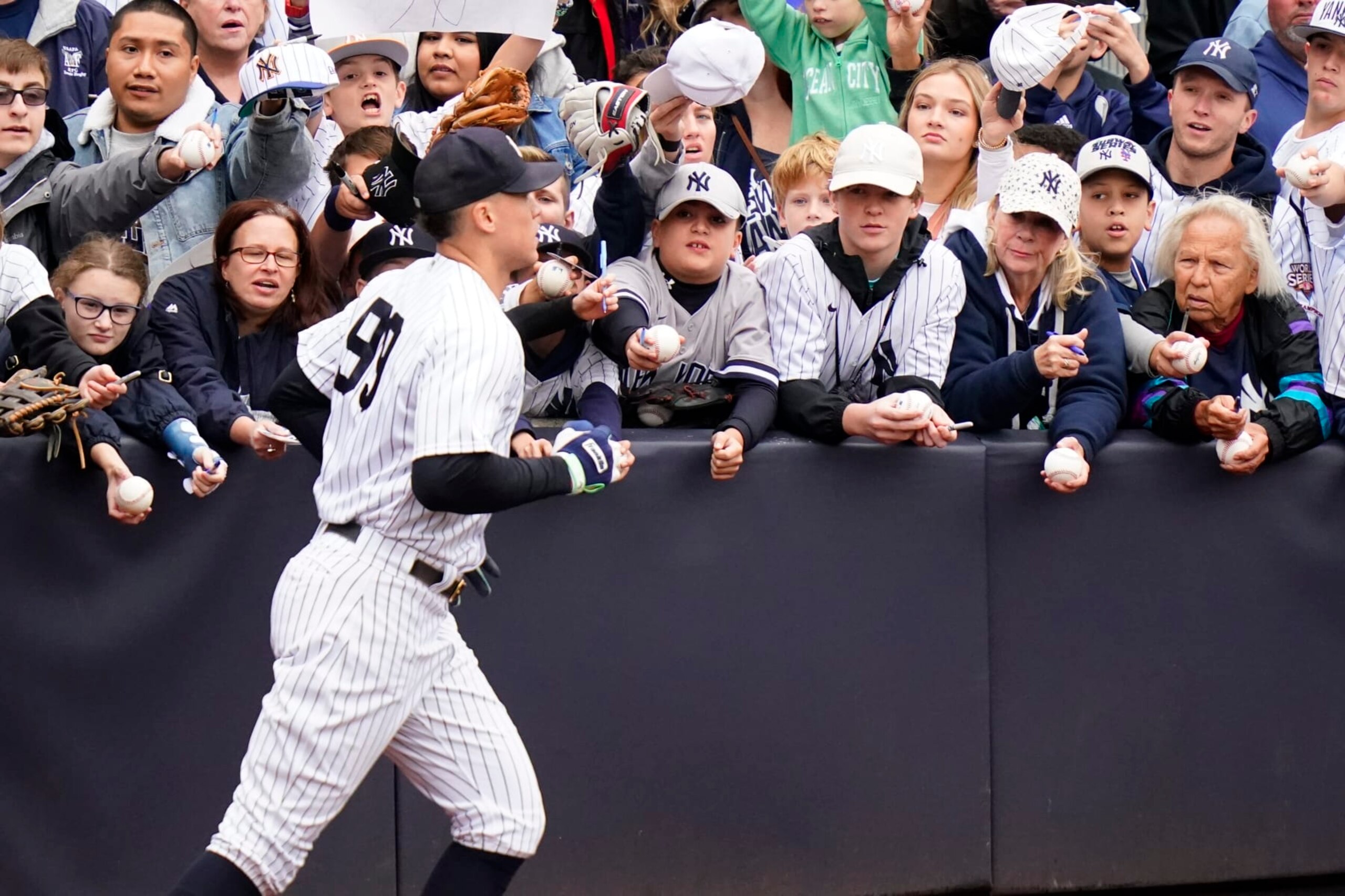 New York Yankees' Aaron Judge (99) passes fans waiting for autographs before a baseball game against the Baltimore Orioles Sunday, Oct. 2, 2022, in New York. (AP Photo/Frank Franklin II)