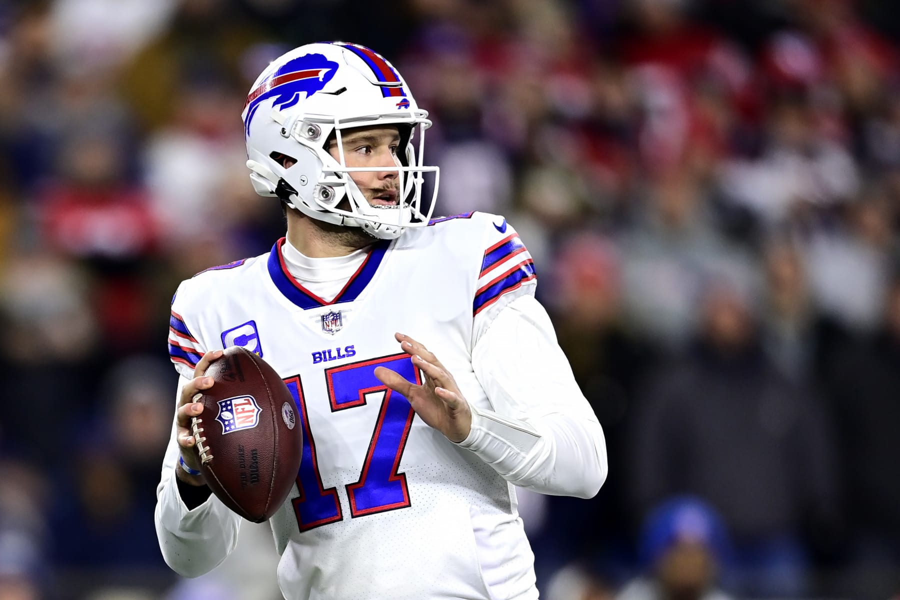 FOXBOROUGH, MASSACHUSETTS - DECEMBER 01: Quarterback Josh Allen #17 of the Buffalo Bills drops back to pass in the first quarter against the New England Patriots at Gillette Stadium on December 01, 2022 in Foxborough, Massachusetts. (Photo by Billie Weiss/Getty Images)