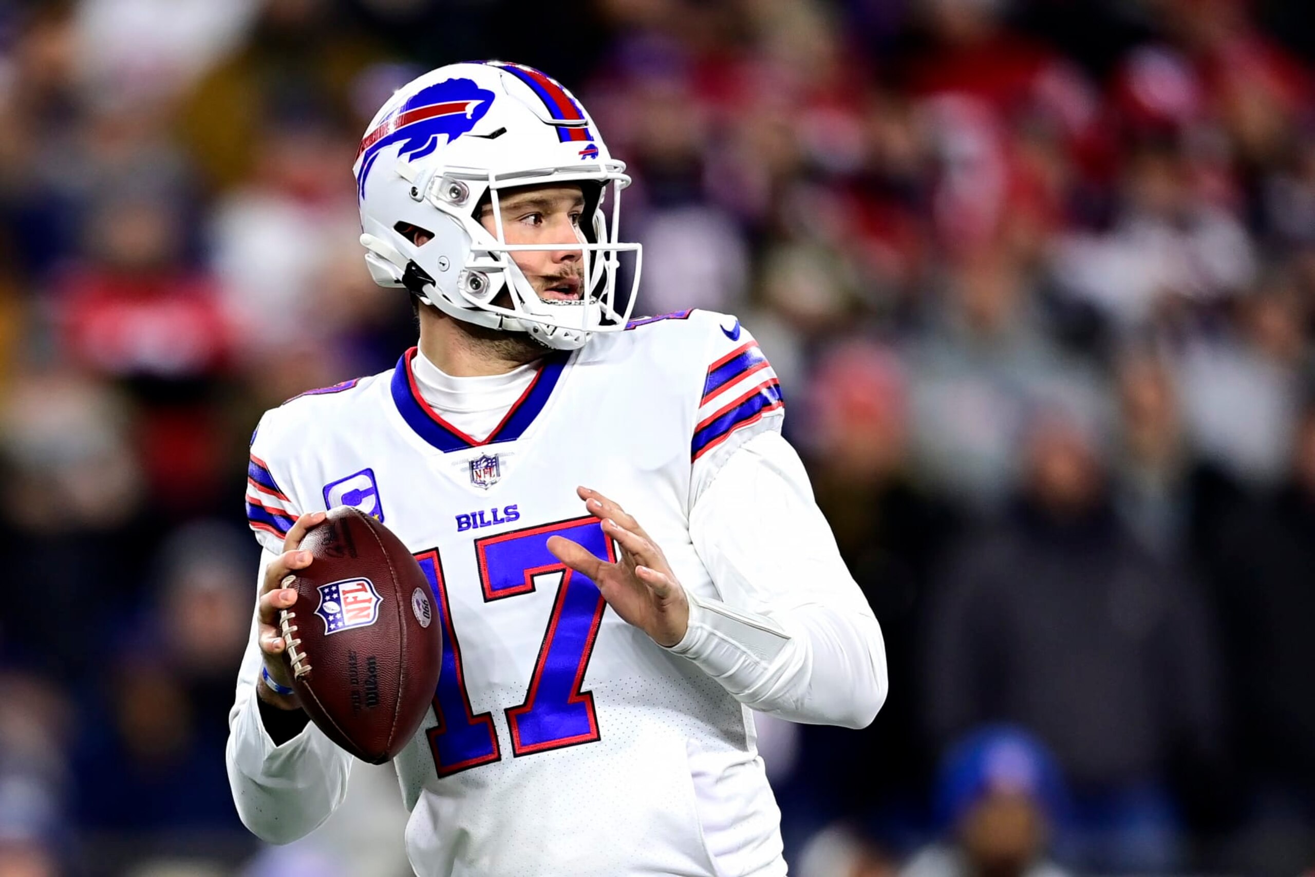 FOXBOROUGH, MASSACHUSETTS - DECEMBER 01: Quarterback Josh Allen #17 of the Buffalo Bills drops back to pass in the first quarter against the New England Patriots at Gillette Stadium on December 01, 2022 in Foxborough, Massachusetts. (Photo by Billie Weiss/Getty Images)