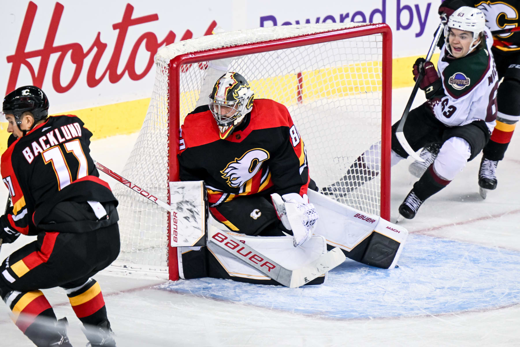 CALGARY, AB - DECEMBER 05: Calgary Flames Goalie Dan Vladar (80) keeps his eye on the play during the first period of an NHL game between the Calgary Flames and the Arizona Coyotes on December 5, 2022, at the Scotiabank Saddledome in Calgary, AB. (Photo by Brett Holmes/Icon Sportswire via Getty Images)
