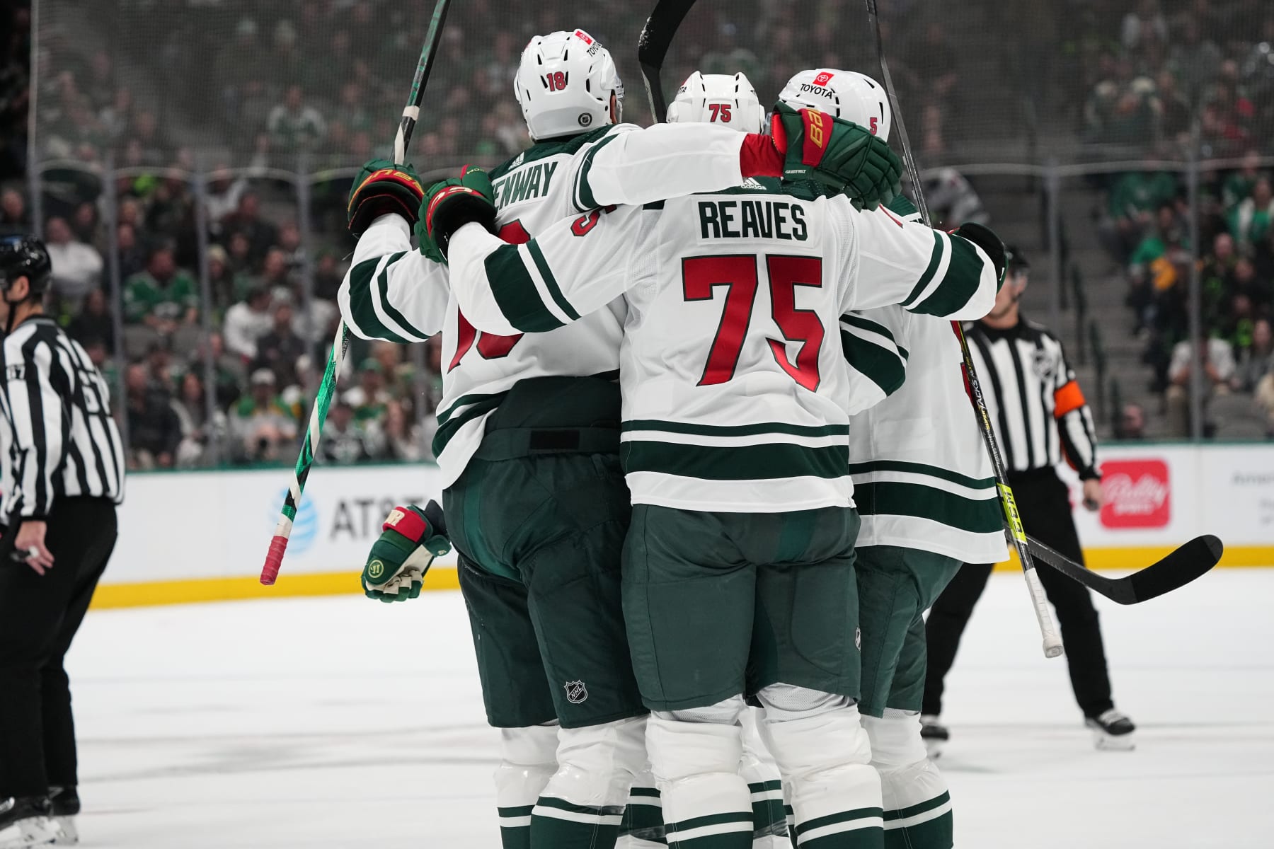 DALLAS, TX - DECEMBER 4: Jordan Greenway #18 and Ryan Reaves #75 of the Minnesota Wild celebrate a goal against the Dallas Stars at the American Airlines Center on December 4, 2022 in Dallas, Texas. (Photo by Glenn James/NHLI via Getty Images)