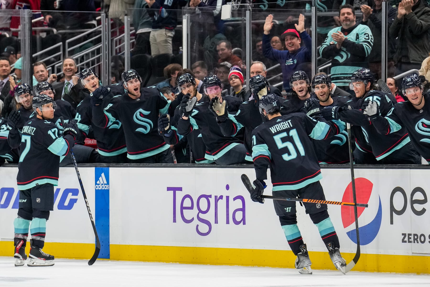 SEATTLE, WASHINGTON - DECEMBER 6: Shane Wright #51 of the Seattle Kraken celebrates his first career NHL goal with the bench during the first period of a game against the Montreal Canadiens at Climate Pledge Arena on December 6, 2022 in Seattle, Washington. (Photo by Christopher Mast/NHLI via Getty Images)