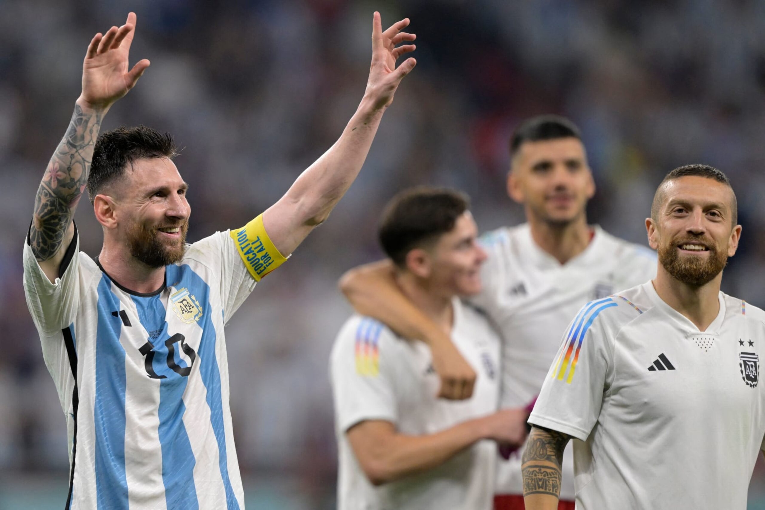 Argentina's forward #10 Lionel Messi (L) celebrates with his teammates after they won the Qatar 2022 World Cup round of 16 football match between Argentina and Australia at the Ahmad Bin Ali Stadium in Al-Rayyan, west of Doha on December 3, 2022. (Photo by JUAN MABROMATA / AFP) (Photo by JUAN MABROMATA/AFP via Getty Images)