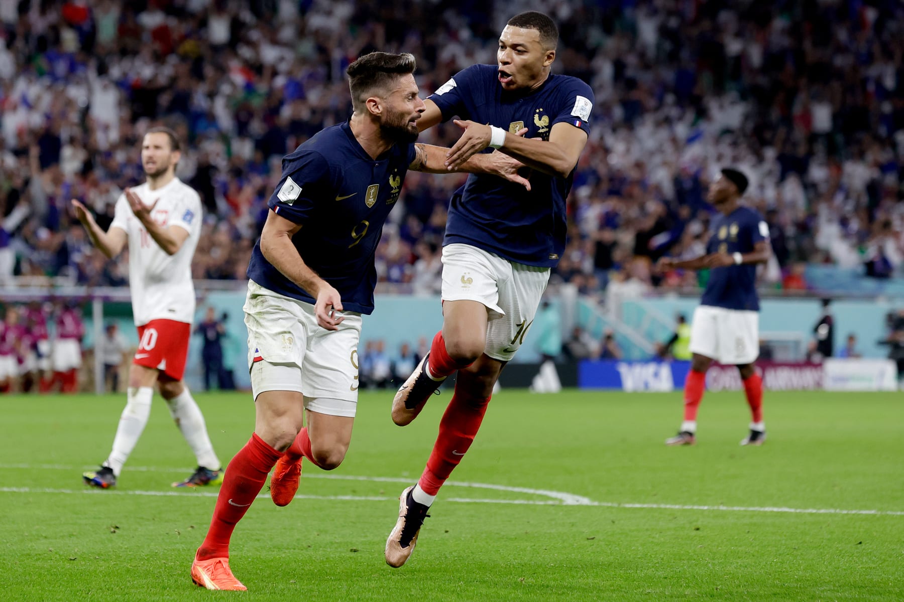 DOHA, QATAR - DECEMBER 4: Oliver Giroud of France celebrates 1-0 with Kylian Mbappe of France  during the  World Cup match between France  v Poland at the Al Thumama Stadium on December 4, 2022 in Doha Qatar (Photo by Eric Verhoeven/Soccrates/Getty Images)