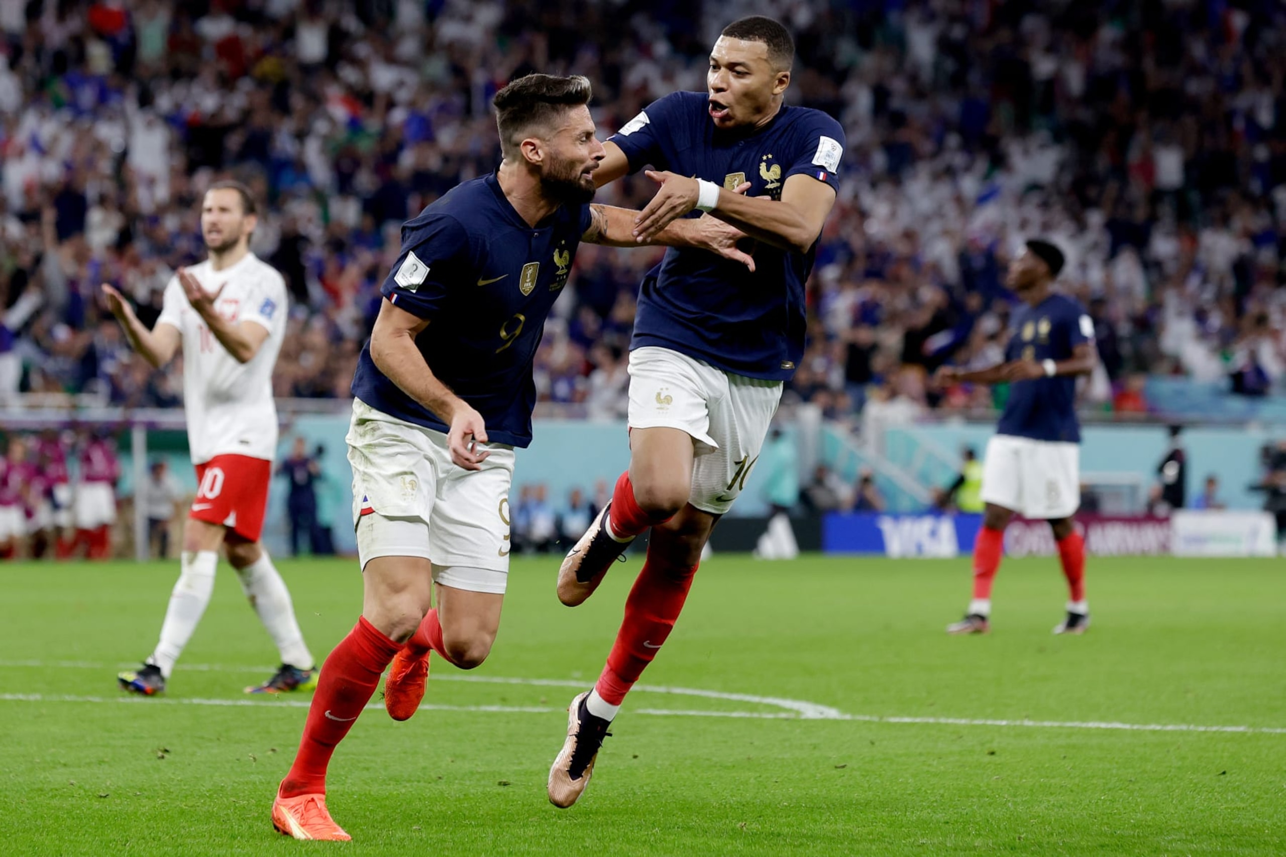 DOHA, QATAR - DECEMBER 4: Oliver Giroud of France celebrates 1-0 with Kylian Mbappe of France  during the  World Cup match between France  v Poland at the Al Thumama Stadium on December 4, 2022 in Doha Qatar (Photo by Eric Verhoeven/Soccrates/Getty Images)