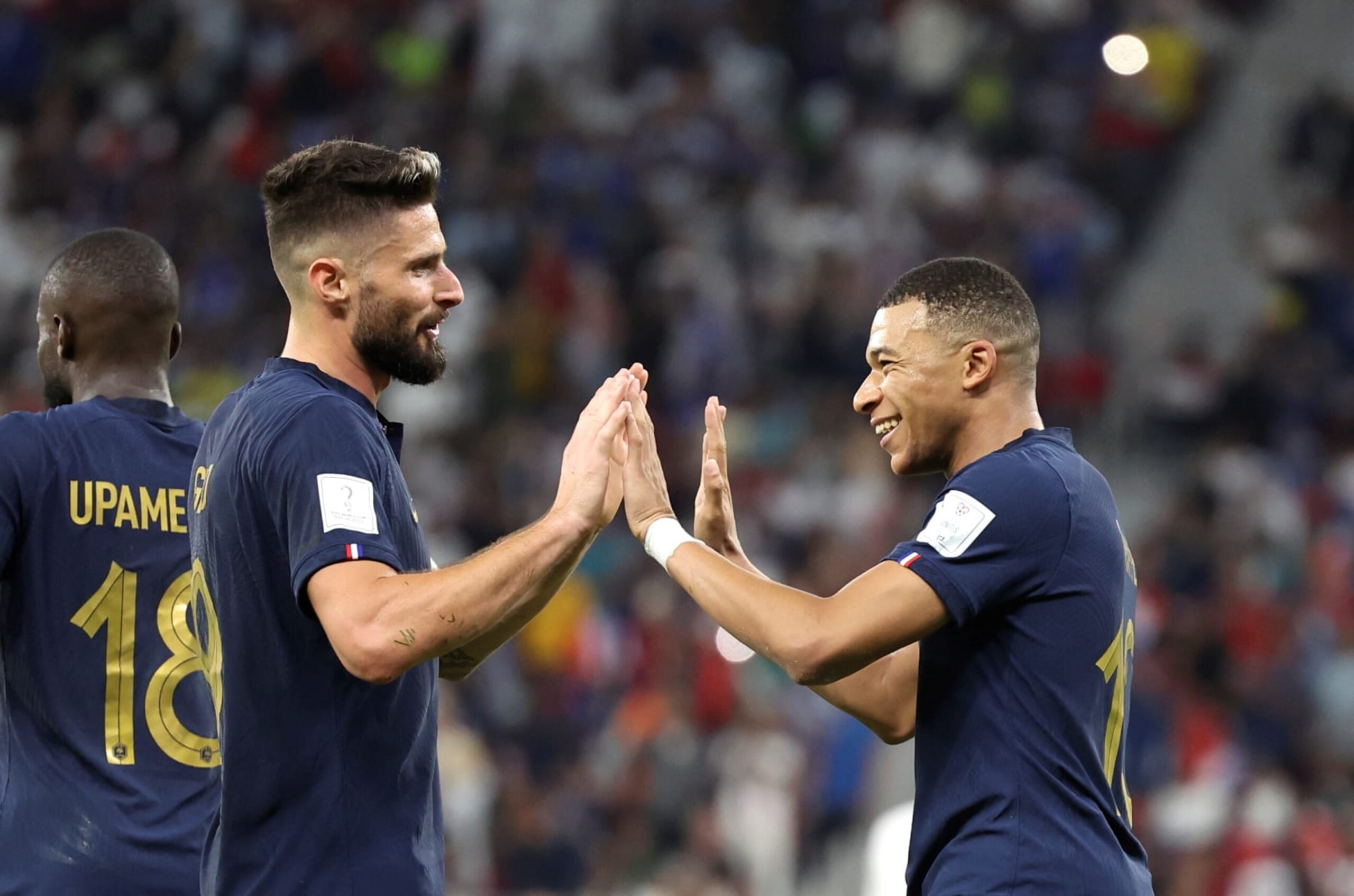 Kylian Mbappe R of France celebrates his goal with teammate Olivier Giroud C during the Round of 16 match between France and Poland of the 2022 FIFA World Cup at Al Thumama Stadium in Doha, Qatar, Dec. 4, 2022. (Photo by Cao Can/Xinhua via Getty Images)