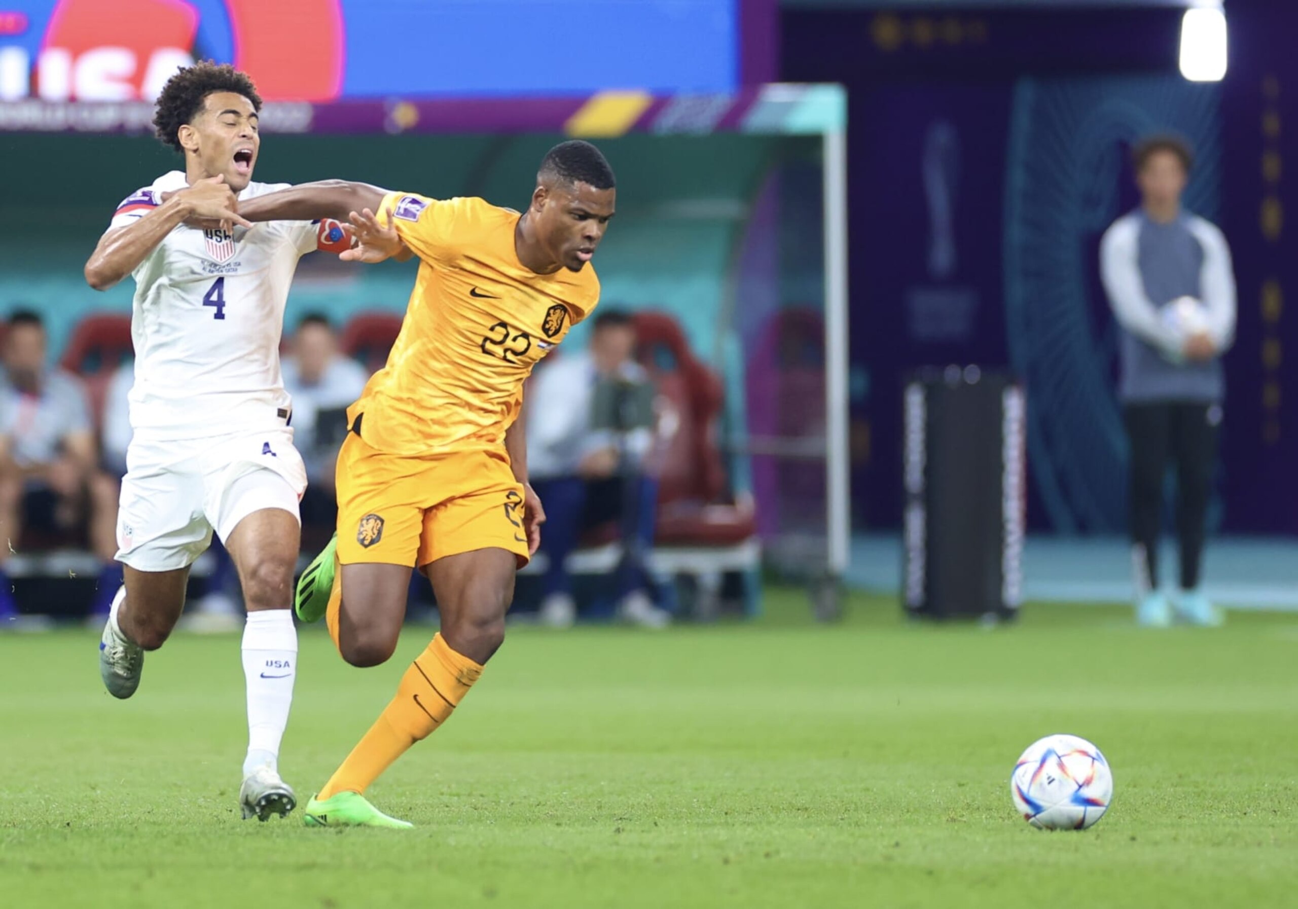 DOHA, QATAR - DECEMBER 03: Denzel Dumfries (22) of Netherlands in action against Tyler Adams (4) of USA during the FIFA World Cup Qatar 2022 Round of 16 match between Netherlands and USA at Khalifa International Stadium on December 03, 2022 in Doha, Qatar. (Photo by Fareed Kotb/Anadolu Agency via Getty Images)