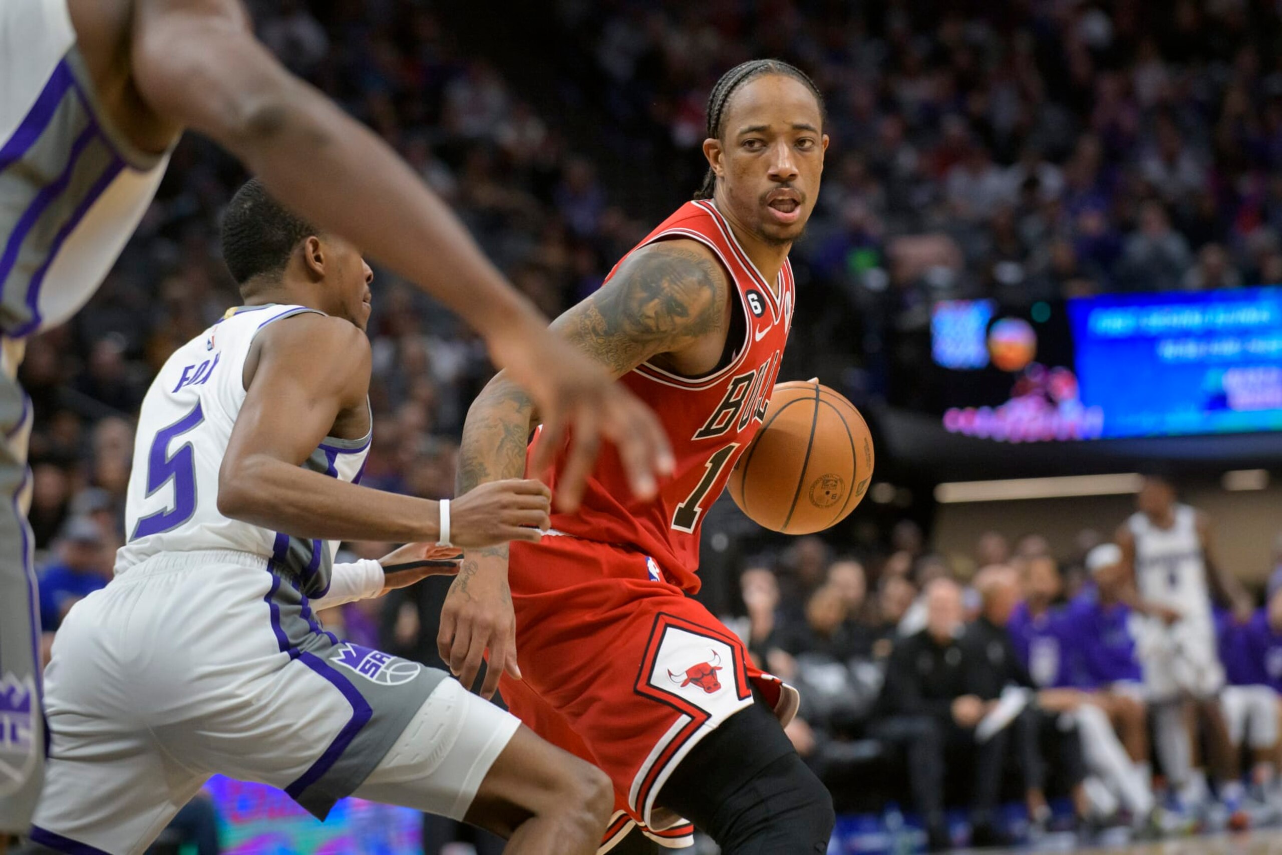 Chicago Bulls forward DeMar DeRozan (11) is guarded by Sacramento Kings guard De'Aaron Fox (5) during the second half of an NBA basketball game in Sacramento, Calif., Sunday, Dec. 4, 2022. The Kings won 110-101. (AP Photo/Randall Benton)