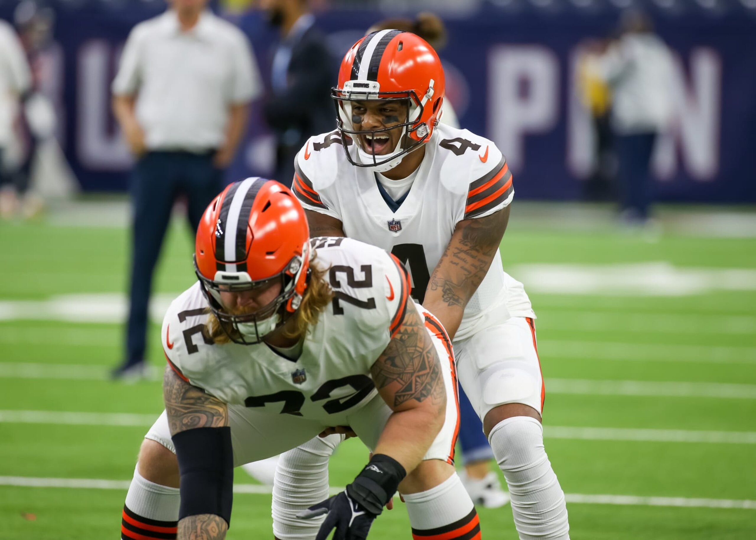HOUSTON, TX - DECEMBER 04:  Cleveland Browns guard Hjalte Froholdt (72) and Cleveland Browns quarterback Deshaun Watson (4) warm up during the NFL game between the Cleveland Browns and Houston Texans on December 4, 2022 at NRG Stadium in Houston, Texas.  (Photo by Leslie Plaza Johnson/Icon Sportswire via Getty Images)
