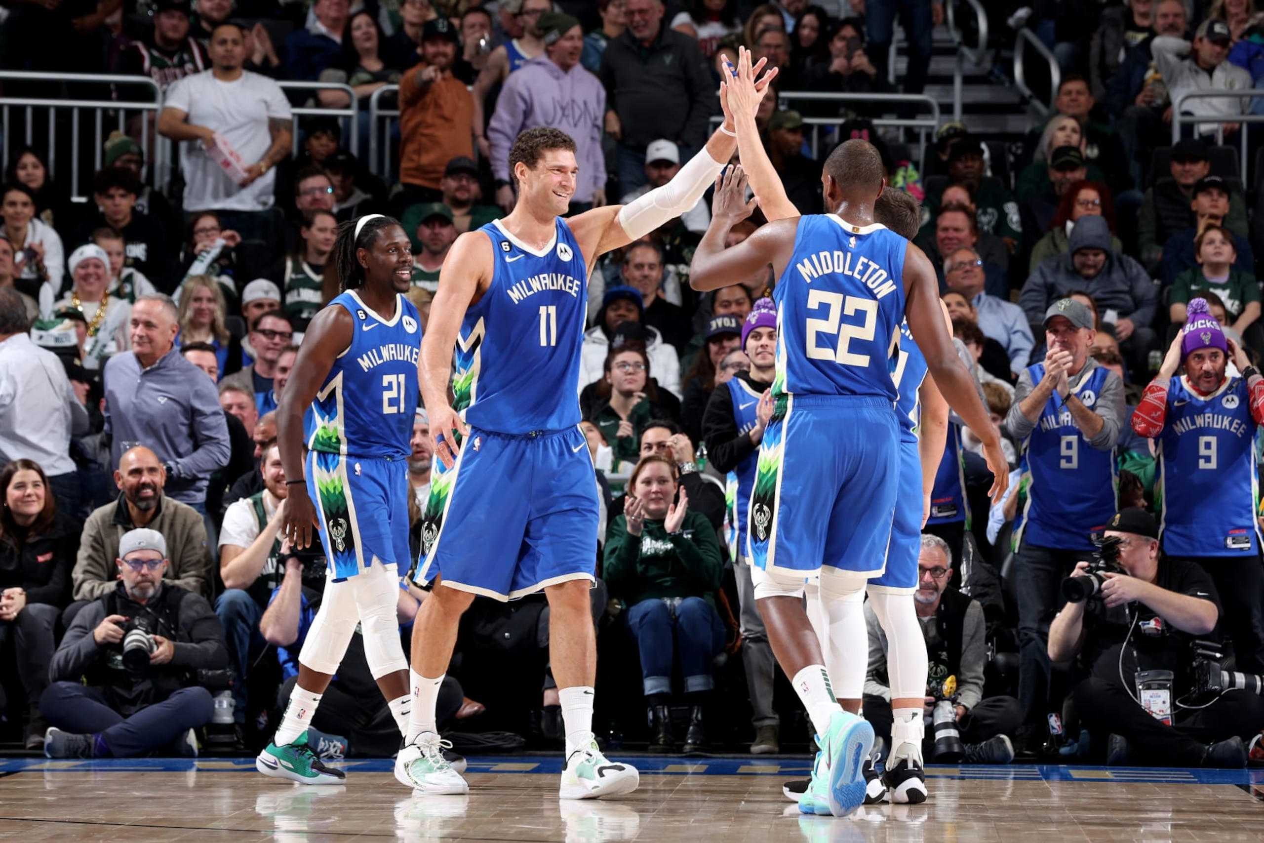 MILWAUKEE, WI - DECEMBER 7: Brook Lopez #11 of the Milwaukee Bucks celebrates with teammates during the game against the Sacramento Kings on December 7, 2022 at the Fiserv Forum Center in Milwaukee, Wisconsin. NOTE TO USER: User expressly acknowledges and agrees that, by downloading and or using this Photograph, user is consenting to the terms and conditions of the Getty Images License Agreement. Mandatory Copyright Notice: Copyright 2022 NBAE (Photo by Jeff Haynes/NBAE via Getty Images). MILWAUKEE, WI - DECEMBER 7: Brook Lopez #11 of the Milwaukee Bucks celebrates with teammates during the game against the Sacramento Kings on December 7, 2022 at the Fiserv Forum Center in Milwaukee, Wisconsin. NOTE TO USER: User expressly acknowledges and agrees that, by downloading and or using this Photograph, user is consenting to the terms and conditions of the Getty Images License Agreement. Mandatory Copyright Notice: Copyright 2022 NBAE (Photo by Jeff Haynes/NBAE via Getty Images).