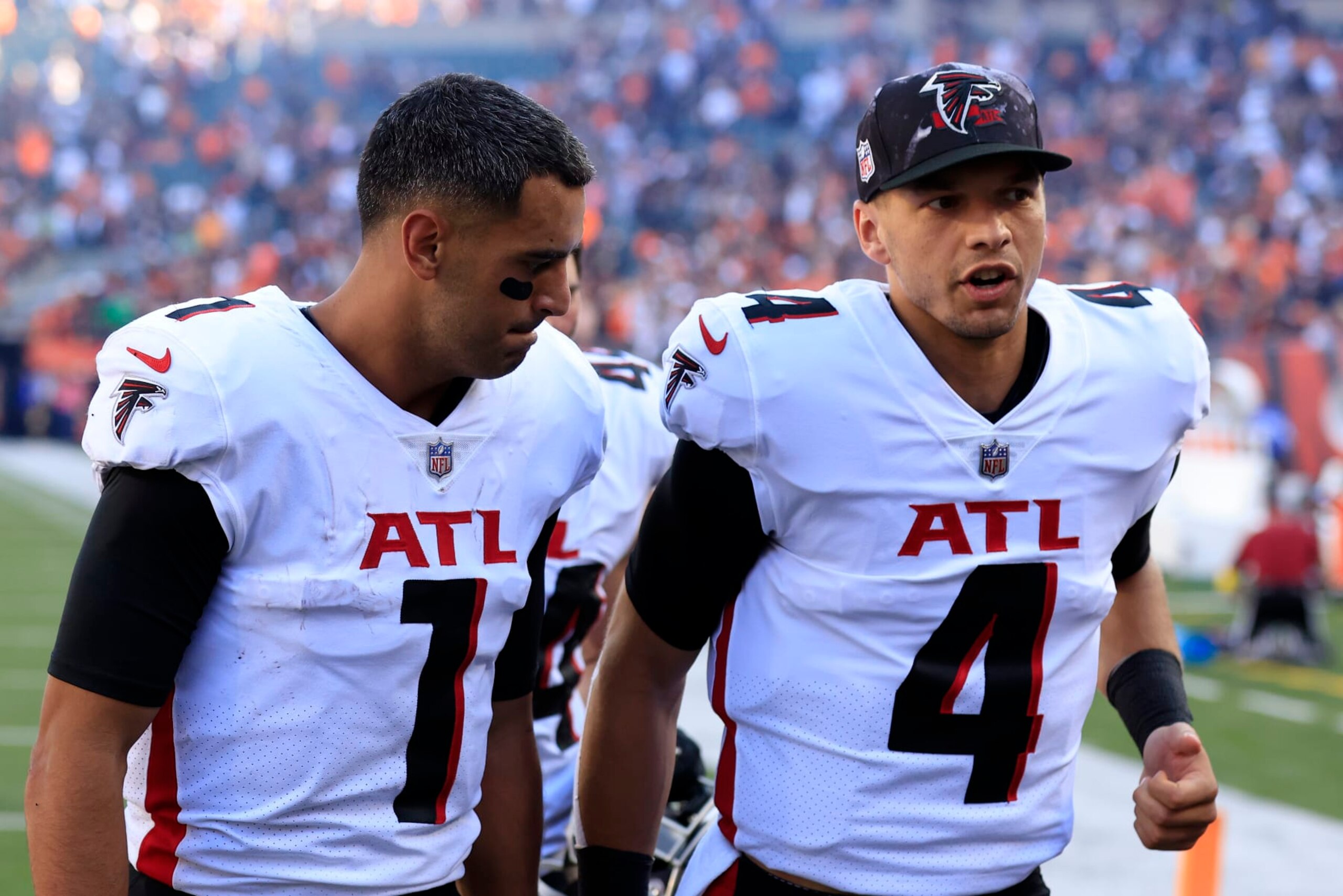CINCINNATI, OHIO - OCTOBER 23: Marcus Mariota #1 and Desmond Ridder #4 of the Atlanta Falcons walk off the field after the game against the Cincinnati Bengals at Paul Brown Stadium on October 23, 2022 in Cincinnati, Ohio. (Photo by Justin Casterline/Getty Images)