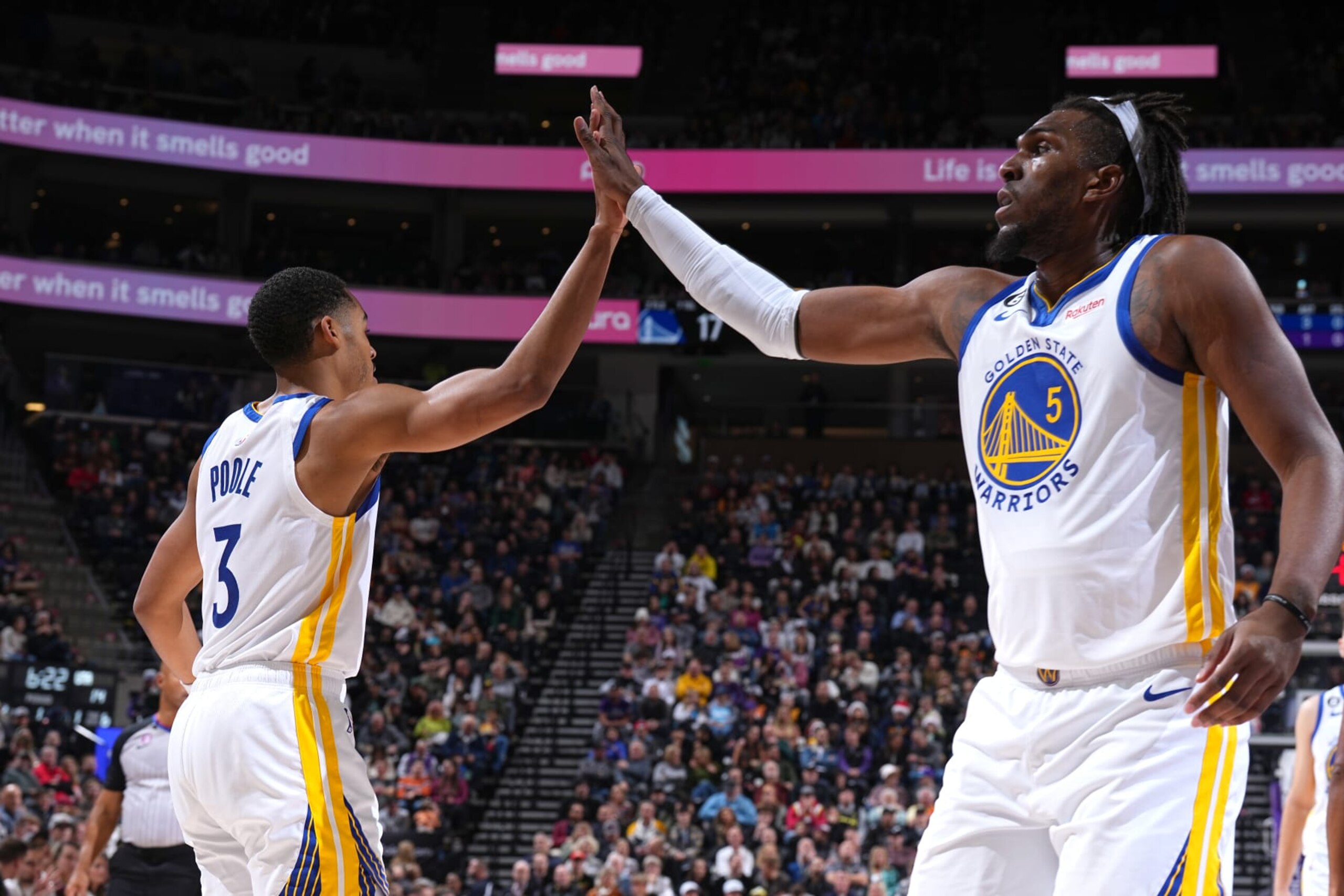 SALT LAKE CITY, UT - DECEMBER 7: Jordan Poole #3 high fives Kevon Looney #5 of the Golden State Warriors during the game against the Utah Jazz on December 7, 2022 at Vivint.SmartHome Arena in Salt Lake City, Utah. NOTE TO USER: User expressly acknowledges and agrees that, by downloading and or using this Photograph, User is consenting to the terms and conditions of the Getty Images License Agreement. Mandatory Copyright Notice: Copyright 2022 NBAE (Photo by Garrett Ellwood/NBAE via Getty Images) SALT LAKE CITY, UT - DECEMBER 7: Jordan Poole #3 high fives Kevon Looney #5 of the Golden State Warriors during the game against the Utah Jazz on December 7, 2022 at Vivint.SmartHome Arena in Salt Lake City, Utah. NOTE TO USER: User expressly acknowledges and agrees that, by downloading and or using this Photograph, User is consenting to the terms and conditions of the Getty Images License Agreement. Mandatory Copyright Notice: Copyright 2022 NBAE (Photo by Garrett Ellwood/NBAE via Getty Images)