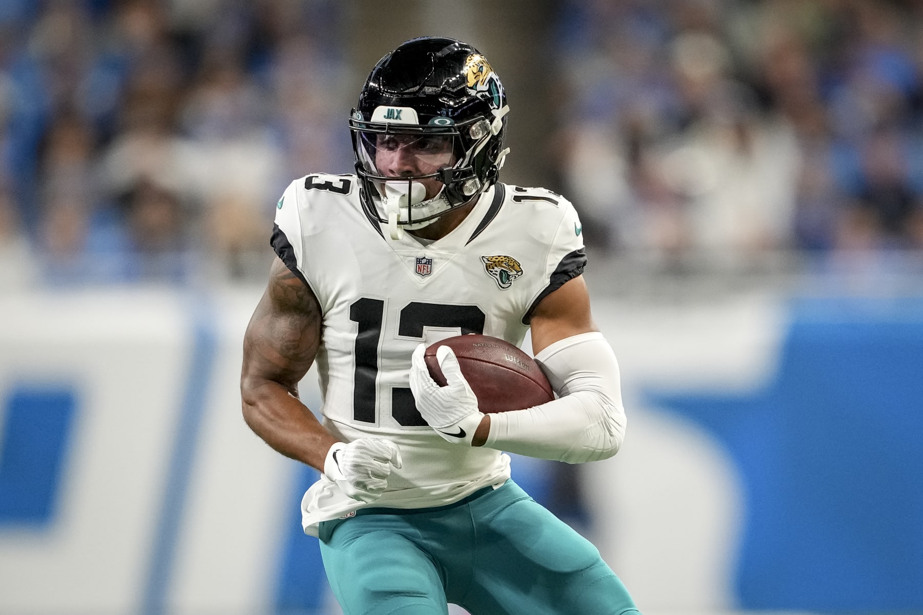 DETROIT, MICHIGAN - DECEMBER 04: Christian Kirk #13 of the Jacksonville Jaguars runs in action against the Detroit Lions at Ford Field on December 04, 2022 in Detroit, Michigan. (Photo by Nic Antaya/Getty Images)