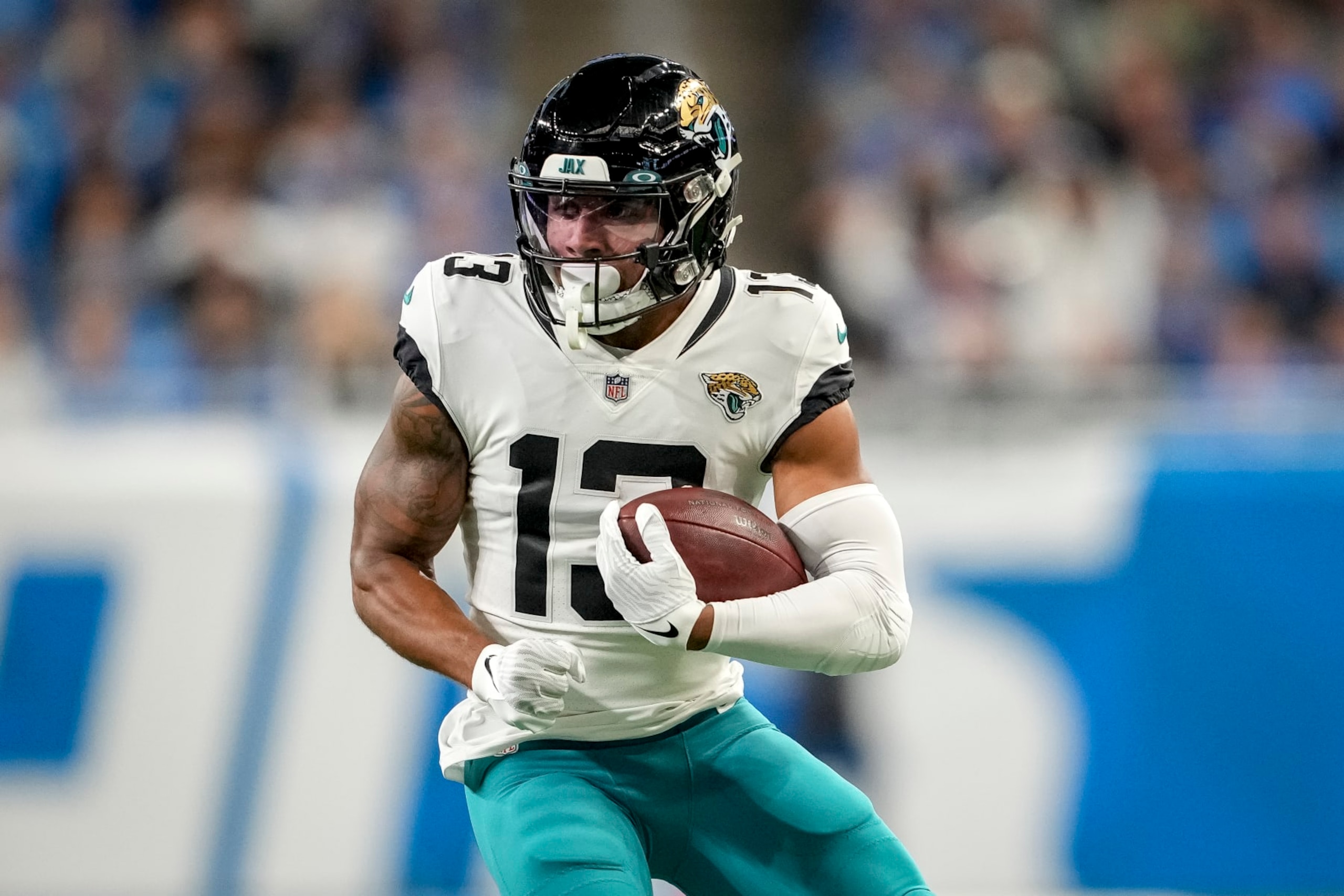 DETROIT, MICHIGAN - DECEMBER 04: Christian Kirk #13 of the Jacksonville Jaguars runs in action against the Detroit Lions at Ford Field on December 04, 2022 in Detroit, Michigan. (Photo by Nic Antaya/Getty Images)