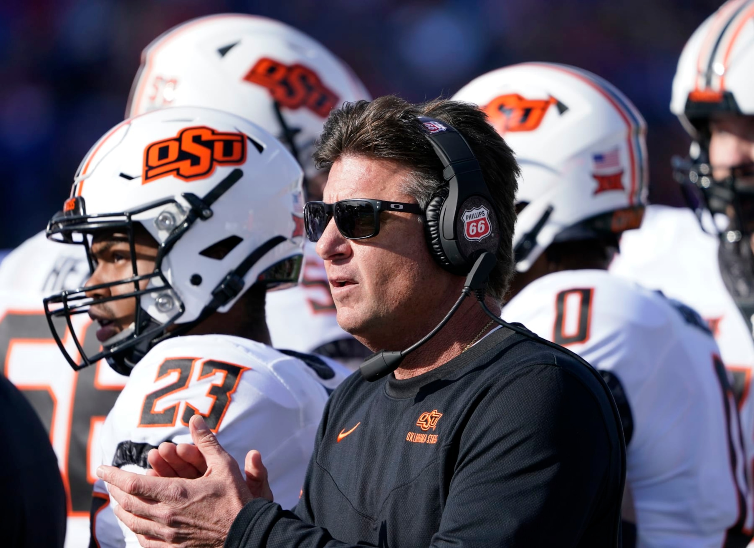 LAWRENCE, KS - NOVEMBER 05: Head coach Mike Gundy of the Oklahoma State Cowboys cheers on his team in the first half against the Kansas Jayhawks at David Booth Kansas Memorial Stadium on November 5, 2022 in Lawrence, Kansas. (Photo by Ed Zurga/Getty Images)