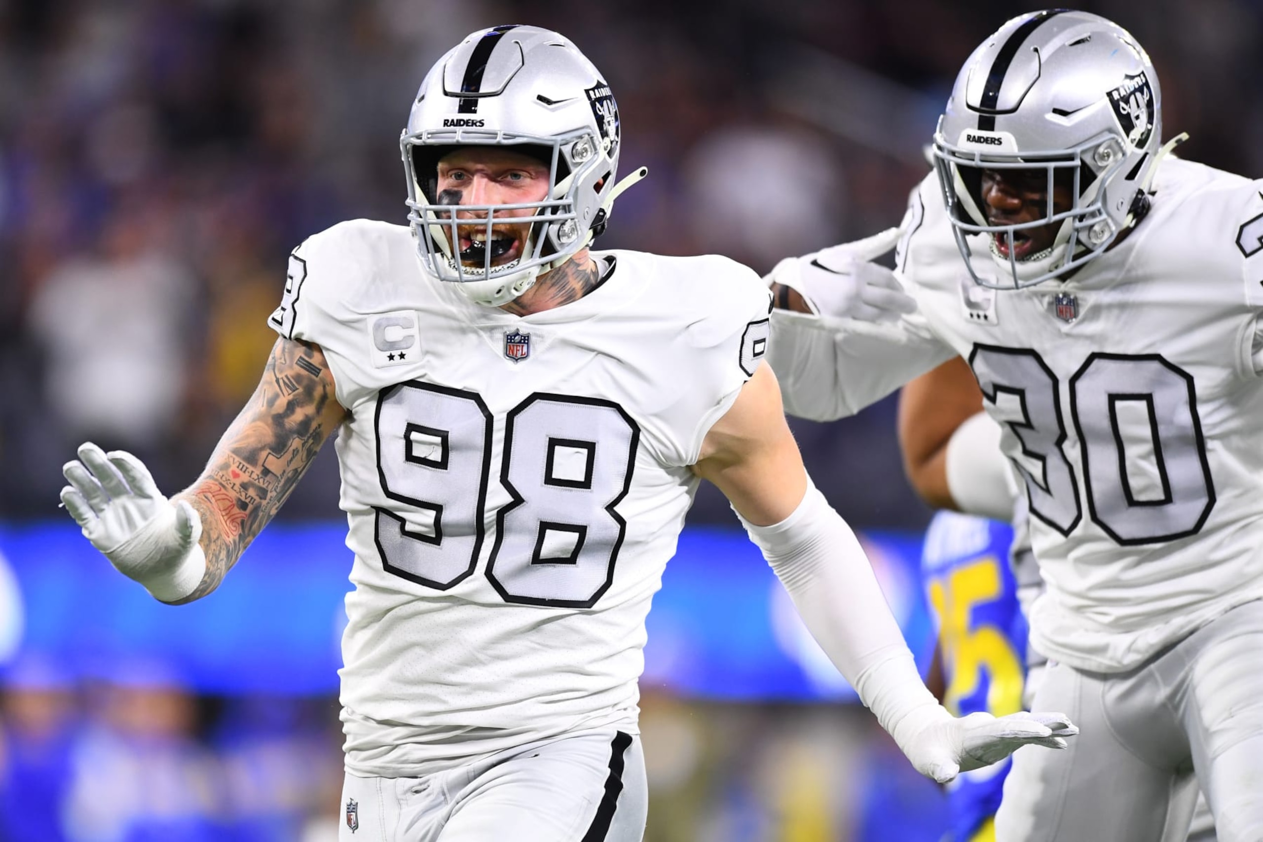 INGLEWOOD, CA - DECEMBER 08: Oakland Raiders defensive end Maxx Crosby (98) celebrates a tackle with safety Duron Harmon (30) during the NFL game between the Oakland Raiders and the Los Angeles Rams on December 8, 2022, at SoFi Stadium in Inglewood, CA. (Photo by Brian Rothmuller/Icon Sportswire via Getty Images)