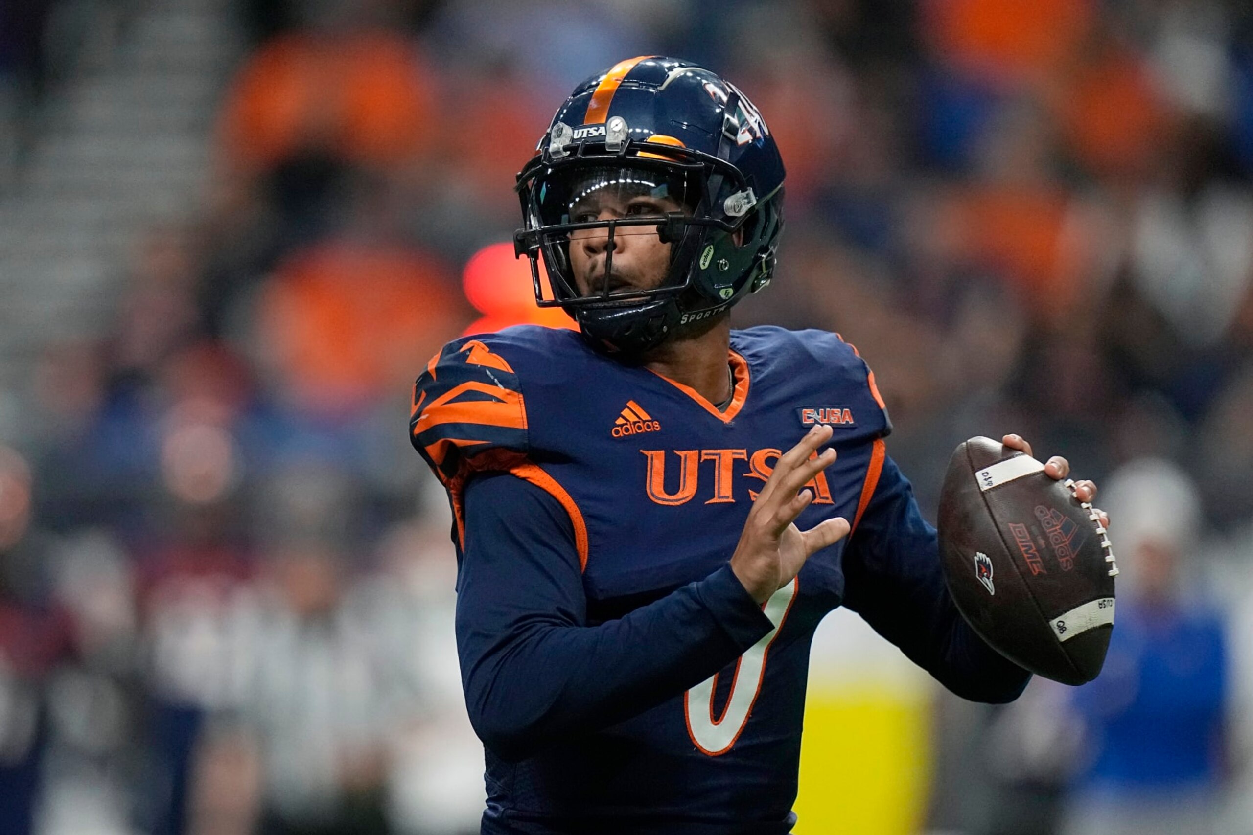 UTSA quarterback Frank Harris (0) looks to pass against North Texas during the first half of an NCAA college football game for the Conference USA championship in San Antonio, Friday, Dec. 2, 2022. (AP Photo/Eric Gay)