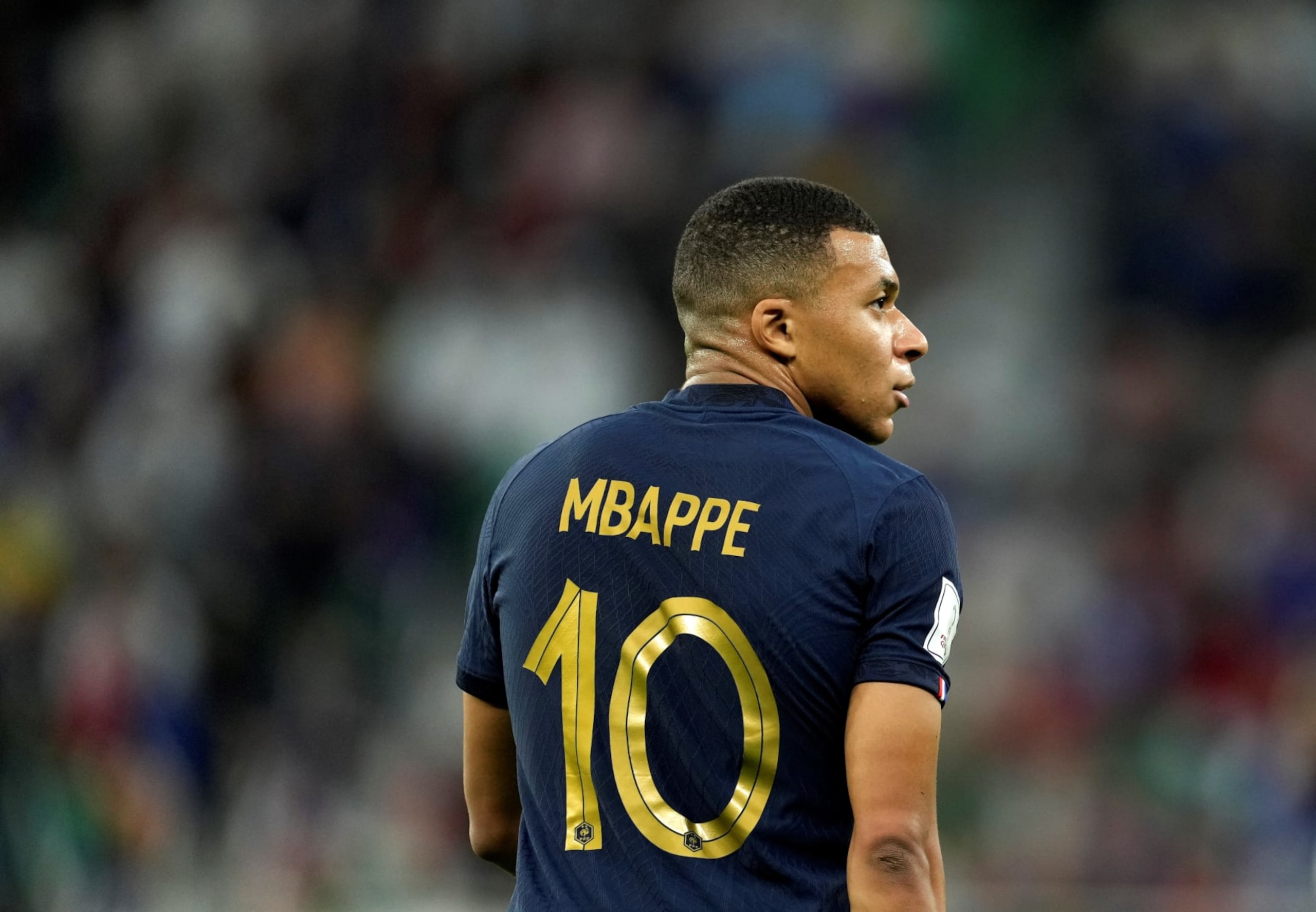Kylian Mbappe of France looks on during the Round of 16 match between France and Poland of the 2022 FIFA World Cup at Al Thumama Stadium in Doha, Qatar, Dec. 4, 2022. (Photo by Xiao Yijiu/Xinhua via Getty Images)