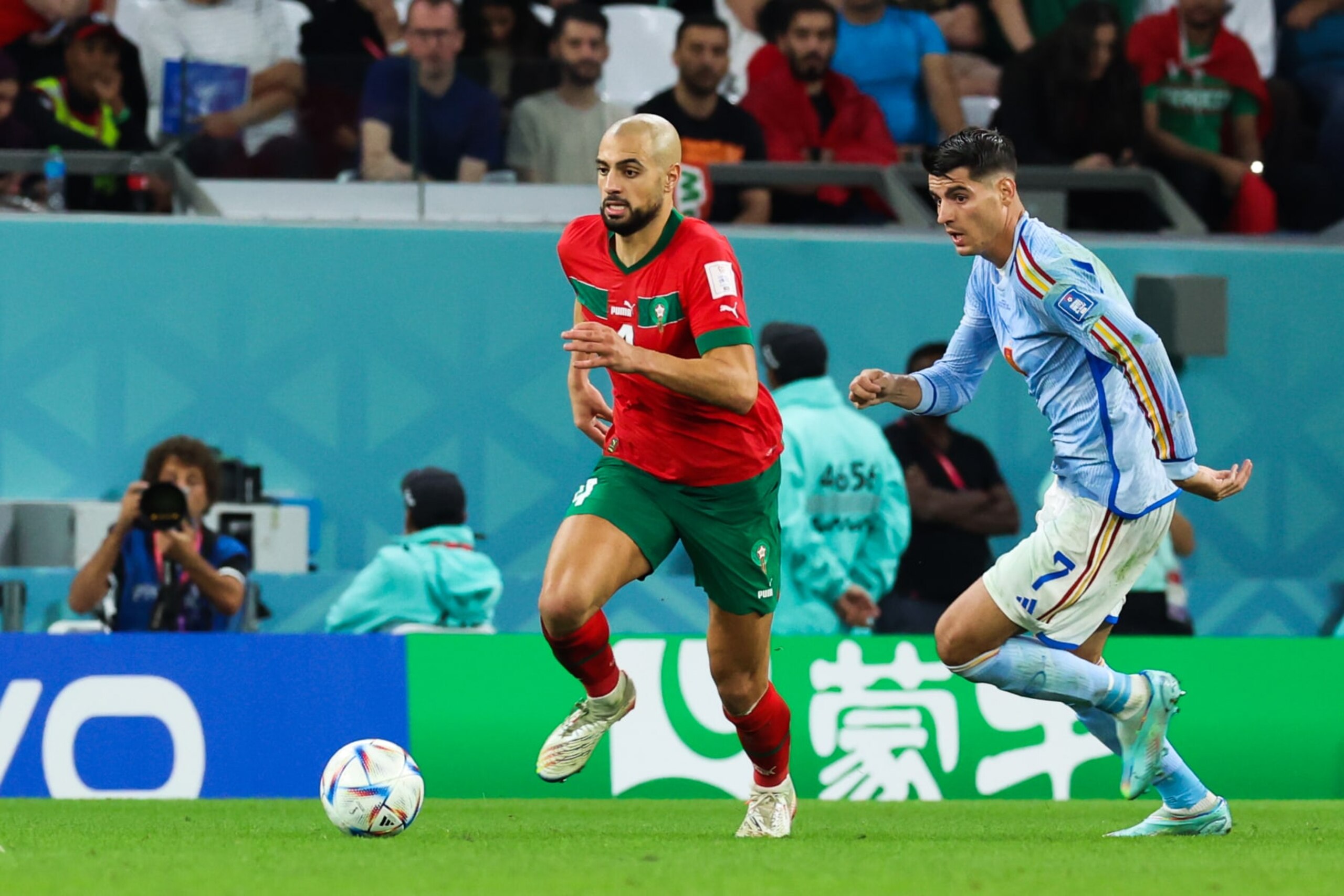 AL RAYYAN, QATAR - DECEMBER 06: Alvaro Morata #7 of Spain and Sofyan Amrab #4 of Morocco compete for the ball during the FIFA World Cup Qatar 2022 Round of 16 match between Morocco and Spain at Education City Stadium on December 6, 2022 in Al Rayyan, Qatar. (Photo by Liu Lu/VCG via Getty Images)