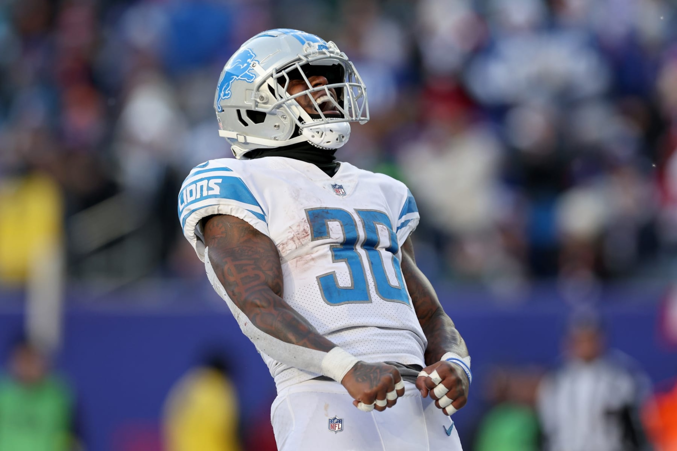 EAST RUTHERFORD, NEW JERSEY - NOVEMBER 20: Jamaal Williams #30 of the Detroit Lions celebrates after scoring a touchdown against the New York Giants during the third quarter at MetLife Stadium on November 20, 2022 in East Rutherford, New Jersey. (Photo by Jamie Squire/Getty Images) EAST RUTHERFORD, NEW JERSEY - NOVEMBER 20: Jamaal Williams #30 of the Detroit Lions celebrates after scoring a touchdown against the New York Giants during the third quarter at MetLife Stadium on November 20, 2022 in East Rutherford, New Jersey. (Photo by Jamie Squire/Getty Images)
