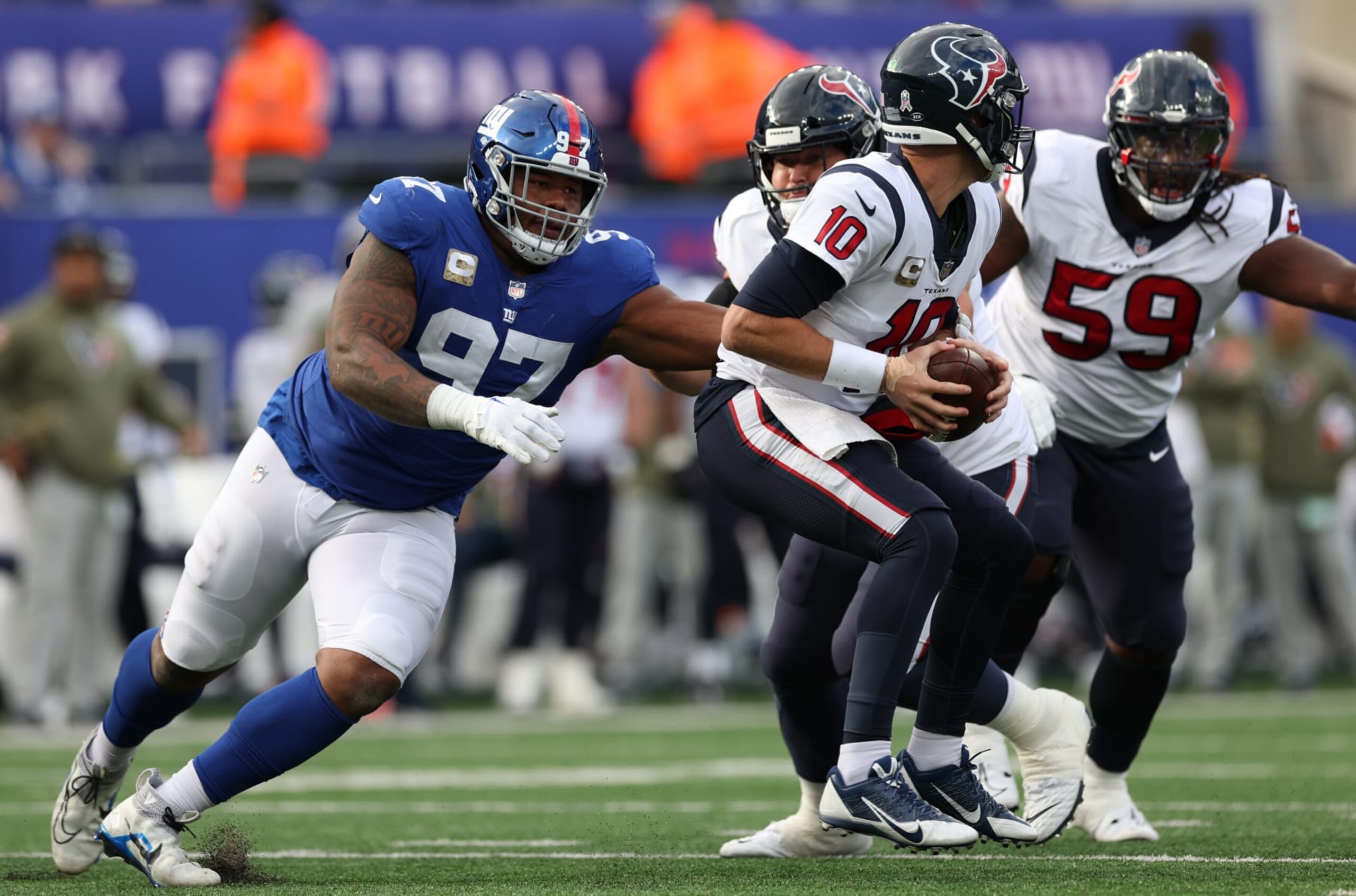 EAST RUTHERFORD, NEW JERSEY - NOVEMBER 13: Dexter Lawrence #97 of the New York Giants sacks Davis Mills #10 of the Houston Texans during the first half at MetLife Stadium on November 13, 2022 in East Rutherford, New Jersey. (Photo by Jamie Squire/Getty Images) EAST RUTHERFORD, NEW JERSEY - NOVEMBER 13: Dexter Lawrence #97 of the New York Giants sacks Davis Mills #10 of the Houston Texans during the first half at MetLife Stadium on November 13, 2022 in East Rutherford, New Jersey. (Photo by Jamie Squire/Getty Images)