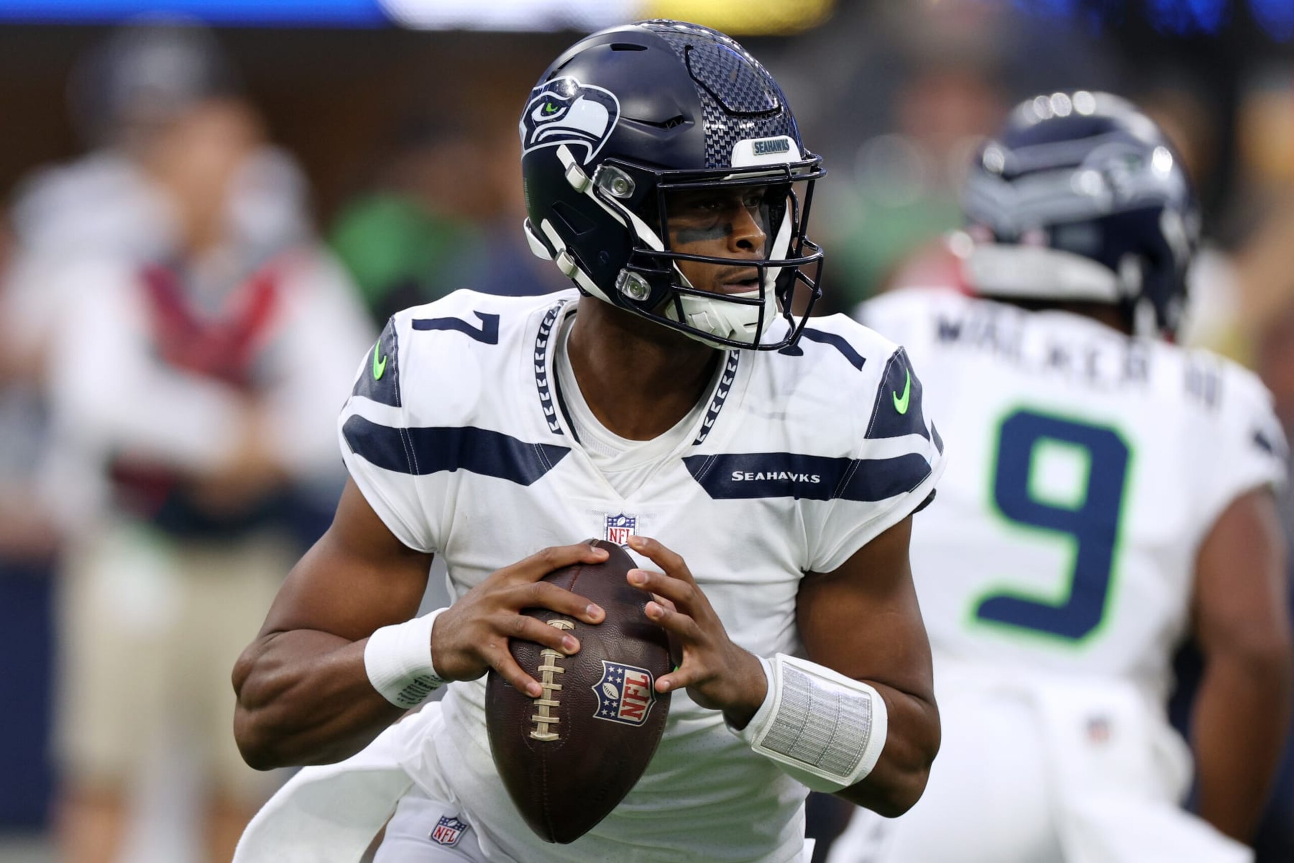 INGLEWOOD, CALIFORNIA - DECEMBER 04: Geno Smith #7 of the Seattle Seahawks looks to pass against the Los Angeles Rams during the first half at SoFi Stadium on December 04, 2022 in Inglewood, California. (Photo by Harry How/Getty Images)
