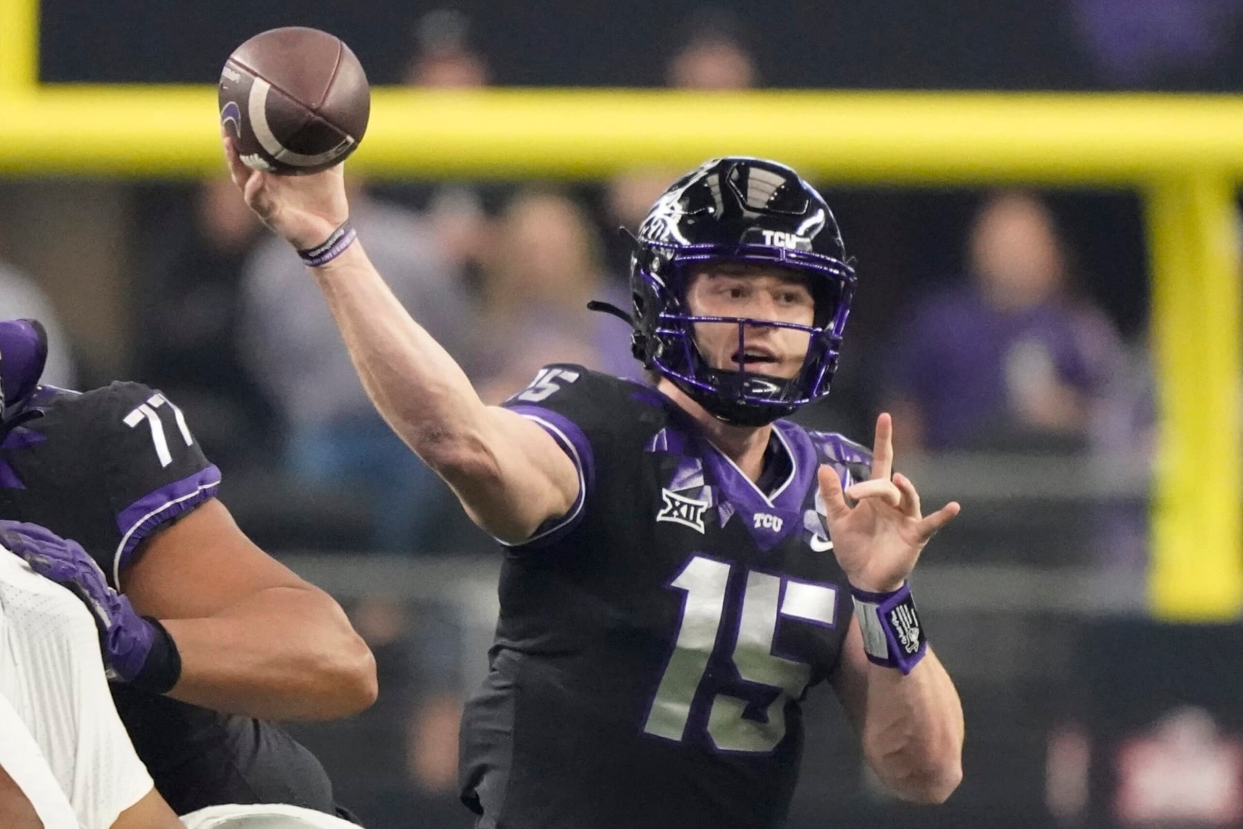 TCU quarterback Max Duggan (15) throws in the first half of the Big 12 Conference championship NCAA college football game against Kansas State, Saturday, Dec. 3, 2022, in Arlington, Texas. (AP Photo/LM Otero)