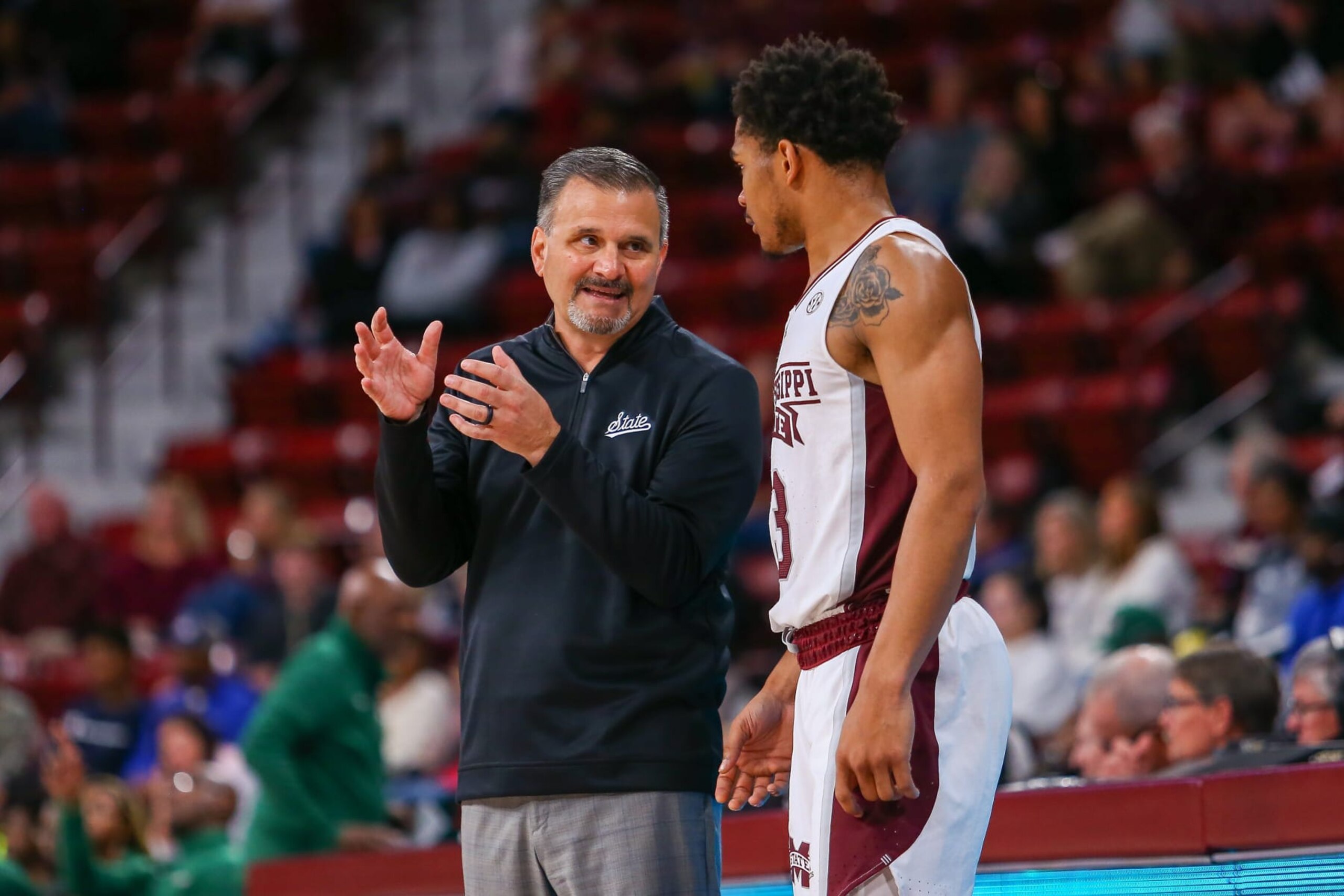 STARKVILLE, MS - DECEMBER 03: Mississippi State Bulldogs head coach Chris Jans talks with Mississippi State Bulldogs guard Shakeel Moore (3) during the game between the Mississippi State Bulldogs and the Mississippi Valley State Delta Devils on December 3, 2022 at Humphrey Coliseum in Starkville, MS. (Photo by Chris McDill/Icon Sportswire via Getty Images)