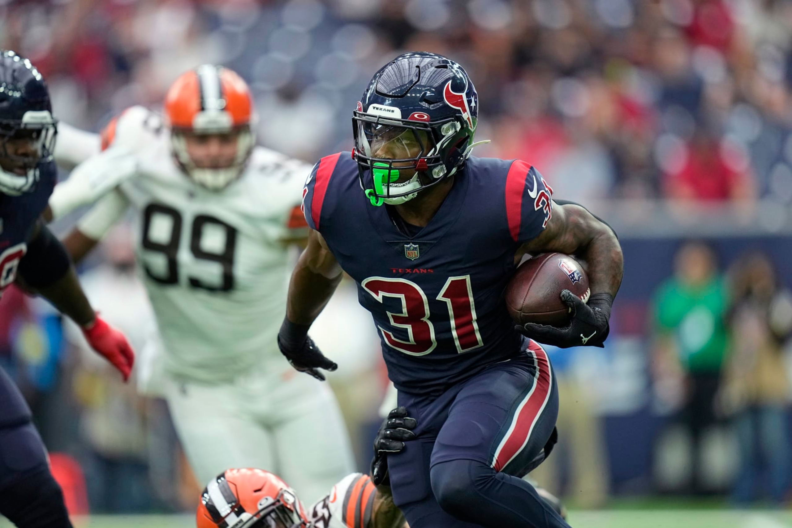 Houston Texans running back Dameon Pierce (31) runs against the Cleveland Browns during the first half of an NFL football game in Houston, Sunday, Dec. 4, 2022, in Houston. (AP Photo/Eric Gay)