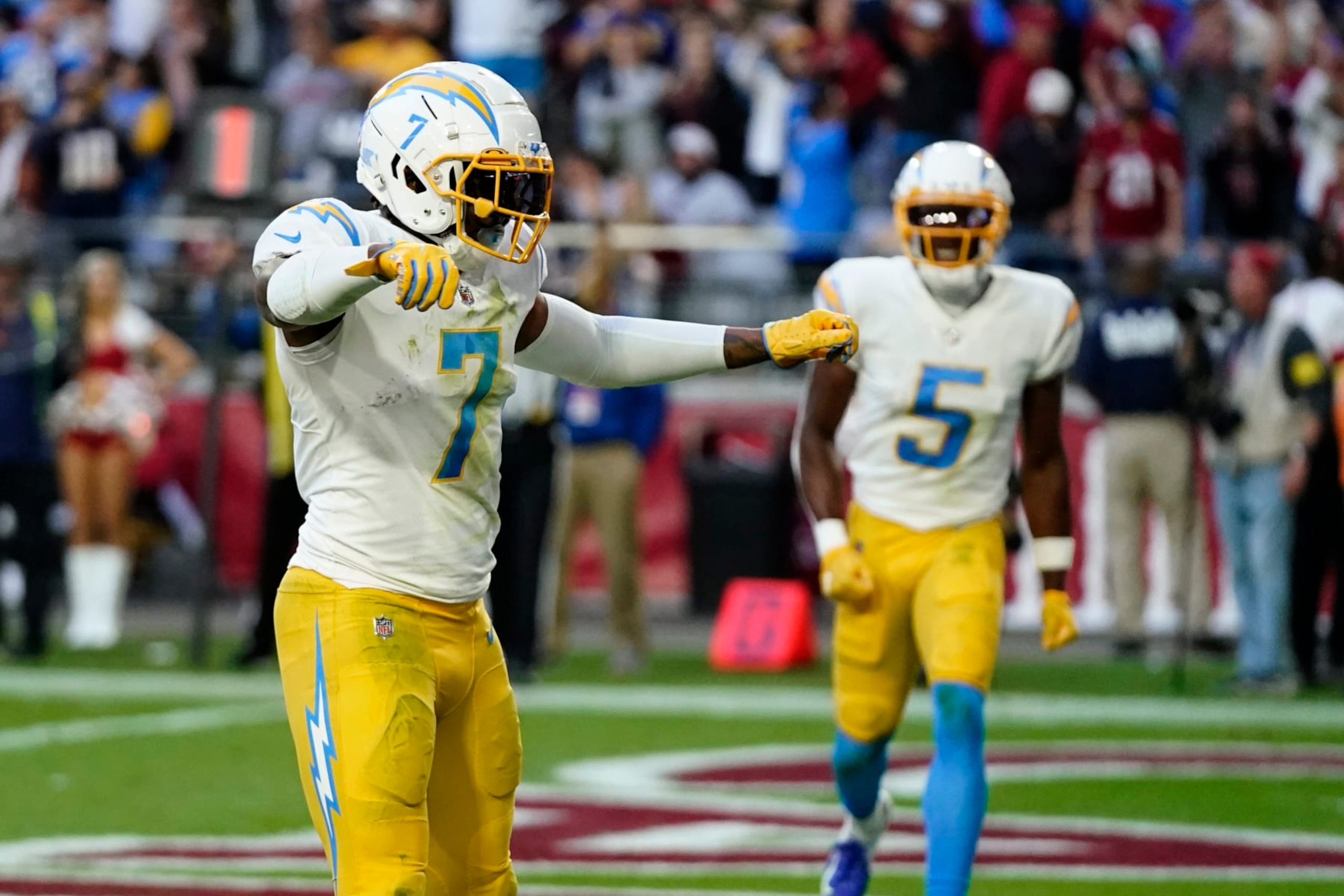 Los Angeles Chargers tight end Gerald Everett (7) celebrates his game-winning two-point conversion during the second half of an NFL football game against the Arizona Cardinals, Sunday, Nov. 27, 2022, in Glendale, Ariz. The Chargers defeated the Cardinals 25-24. (AP Photo/Ross D. Franklin)