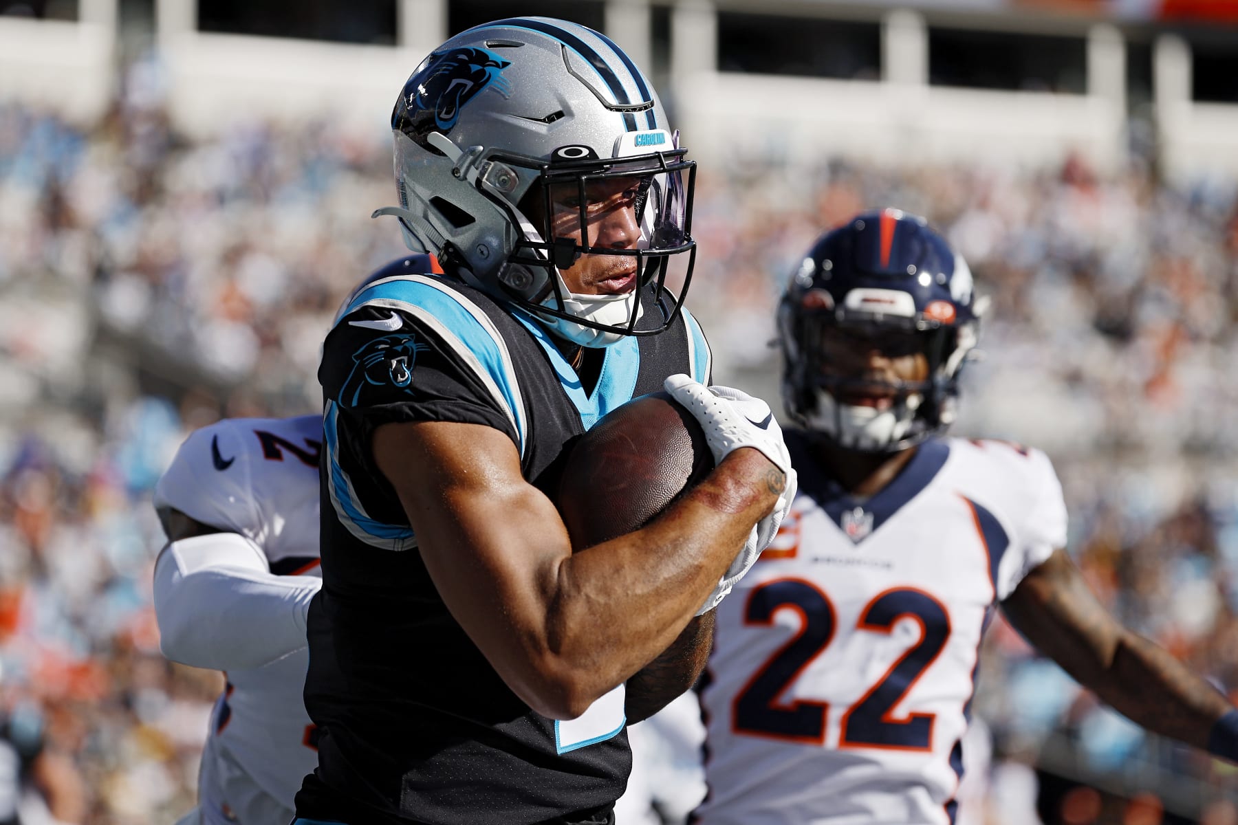 CHARLOTTE, NORTH CAROLINA - NOVEMBER 27: DJ Moore #2 of the Carolina Panthers catches the ball for a touchdown as Pat Surtain II #2 and Kareem Jackson #22 of the Denver Broncos defend during the first quarter at Bank of America Stadium on November 27, 2022 in Charlotte, North Carolina. (Photo by Jared C. Tilton/Getty Images) CHARLOTTE, NORTH CAROLINA - NOVEMBER 27: DJ Moore #2 of the Carolina Panthers catches the ball for a touchdown as Pat Surtain II #2 and Kareem Jackson #22 of the Denver Broncos defend during the first quarter at Bank of America Stadium on November 27, 2022 in Charlotte, North Carolina. (Photo by Jared C. Tilton/Getty Images)