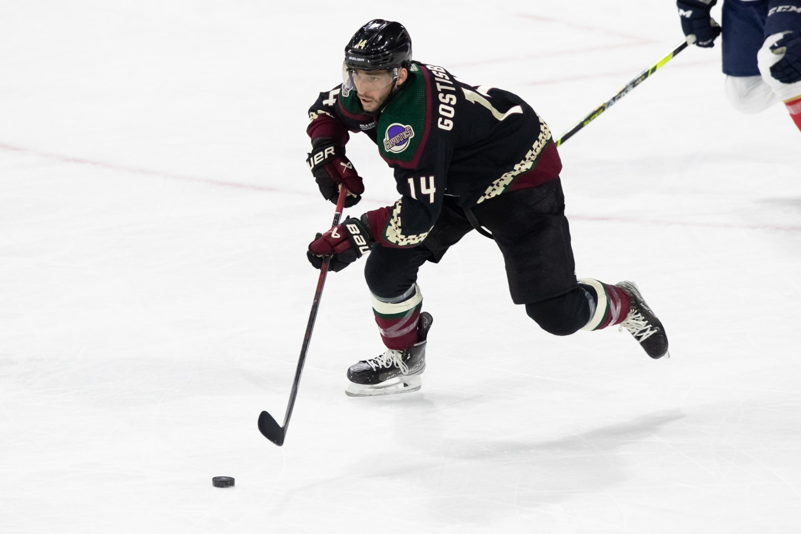 TEMPE, AZ - NOVEMBER 01: Arizona Coyotes Defenceman Shayne Gostisbehere (14) skates the puck up the ice during an NHL game between the Arizona Coyotes and the Florida Panthers on November 1, 2022, at Mullett Arena in Tempe, AZ. (Photo by Zac BonDurant/Icon Sportswire via Getty Images) TEMPE, AZ - NOVEMBER 01: Arizona Coyotes Defenceman Shayne Gostisbehere (14) skates the puck up the ice during an NHL game between the Arizona Coyotes and the Florida Panthers on November 1, 2022, at Mullett Arena in Tempe, AZ. (Photo by Zac BonDurant/Icon Sportswire via Getty Images)