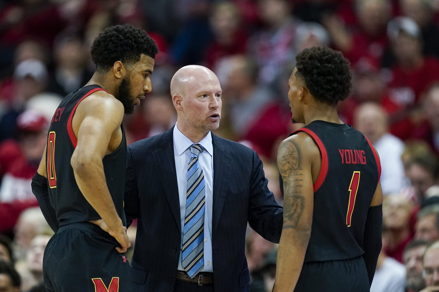 Maryland coach Kevin Willard talks with Don Carey, left, and Jahmir Young (1) during the second half of the team's NCAA college basketball game against Wisconsin on Tuesday, Dec. 6, 2022, in Madison, Wis. Wisconsin won 64-59. (AP Photo/Andy Manis)