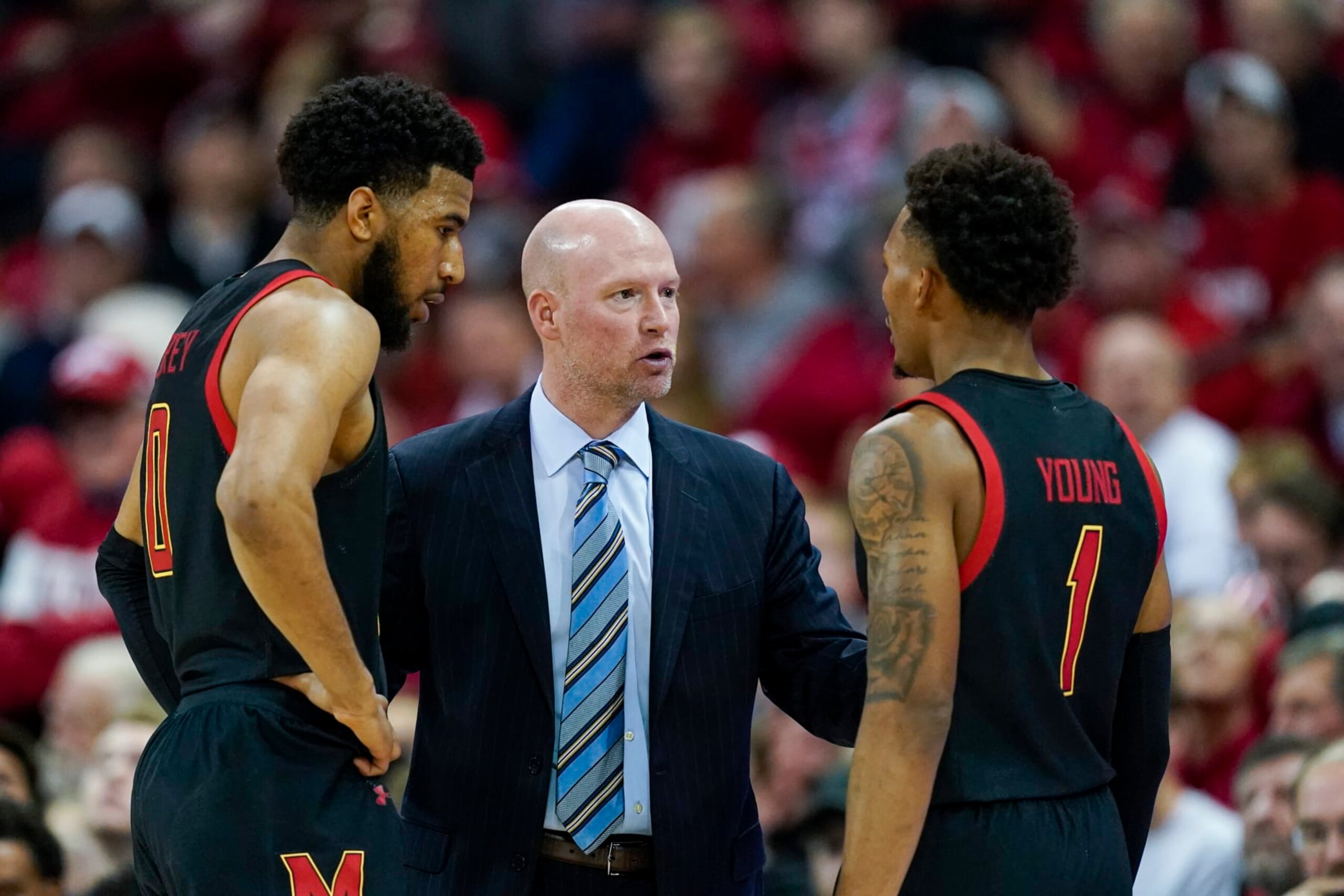 Maryland coach Kevin Willard talks with Don Carey, left, and Jahmir Young (1) during the second half of the team's NCAA college basketball game against Wisconsin on Tuesday, Dec. 6, 2022, in Madison, Wis. Wisconsin won 64-59. (AP Photo/Andy Manis)