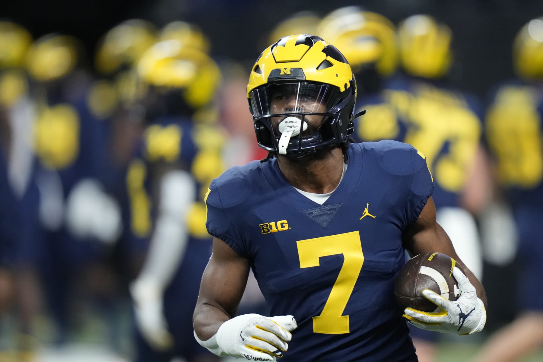 Michigan running back Donovan Edwards warms up before the start of the Big Ten championship NCAA college football game between Michigan and Purdue, Saturday, Dec. 3, 2022, in Indianapolis. (AP Photo/AJ Mast)