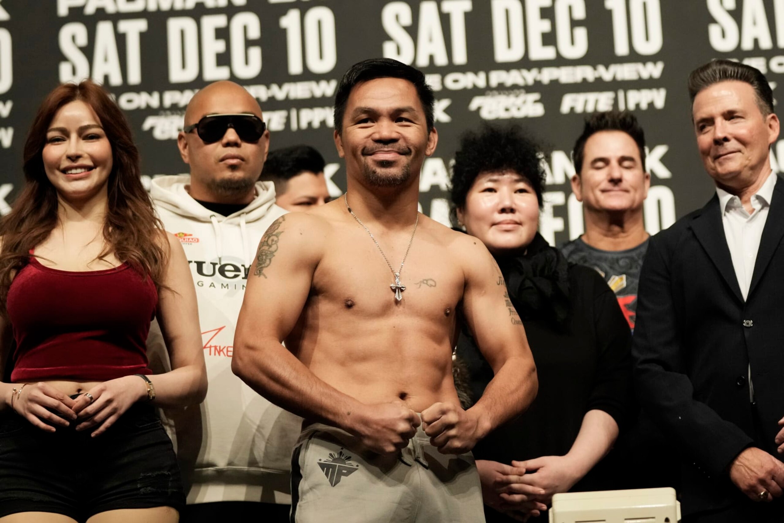 Former Filipino boxer Manny Pacquiao poses for a photo during a weigh-in at the KINTEX in Goyang, South Korea, Saturday, Dec. 10, 2022. Pacquiao will fight in an exhibition match with South Korean martial artist D.K. Yoo on Sunday, Dec. 11. (AP Photo/Ahn Young-joon)