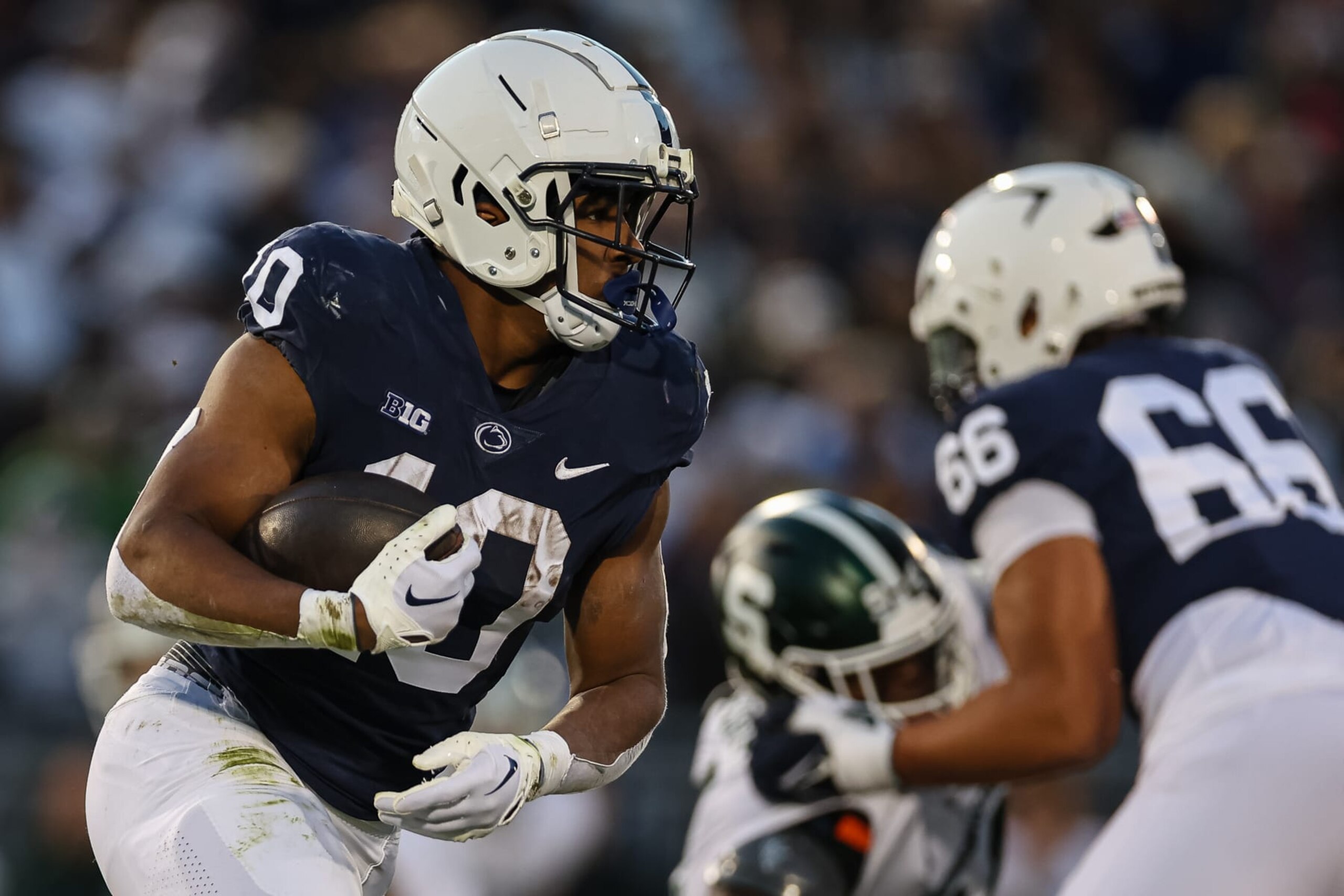 STATE COLLEGE, PA - NOVEMBER 26: Nicholas Singleton #10 of the Penn State Nittany Lions carries the ball against the Michigan State Spartans during the first half at Beaver Stadium on November 26, 2022 in State College, Pennsylvania. (Photo by Scott Taetsch/Getty Images)