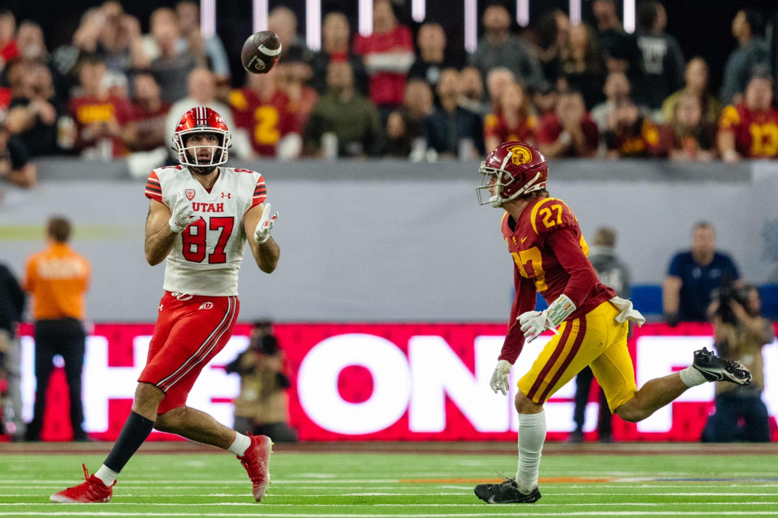 LAS VEGAS, NV - DECEMBER 2: Thomas Yassmin #87 of Utah catches a pass covered by Bryson Shaw #27 of USC during a game between the USC Trojans and the Utah Utes at Allegiant Stadium on December 2, 2022 in Las Vegas, Nevada. (Photo by Jason Allen/ISI Photos/Getty Images).