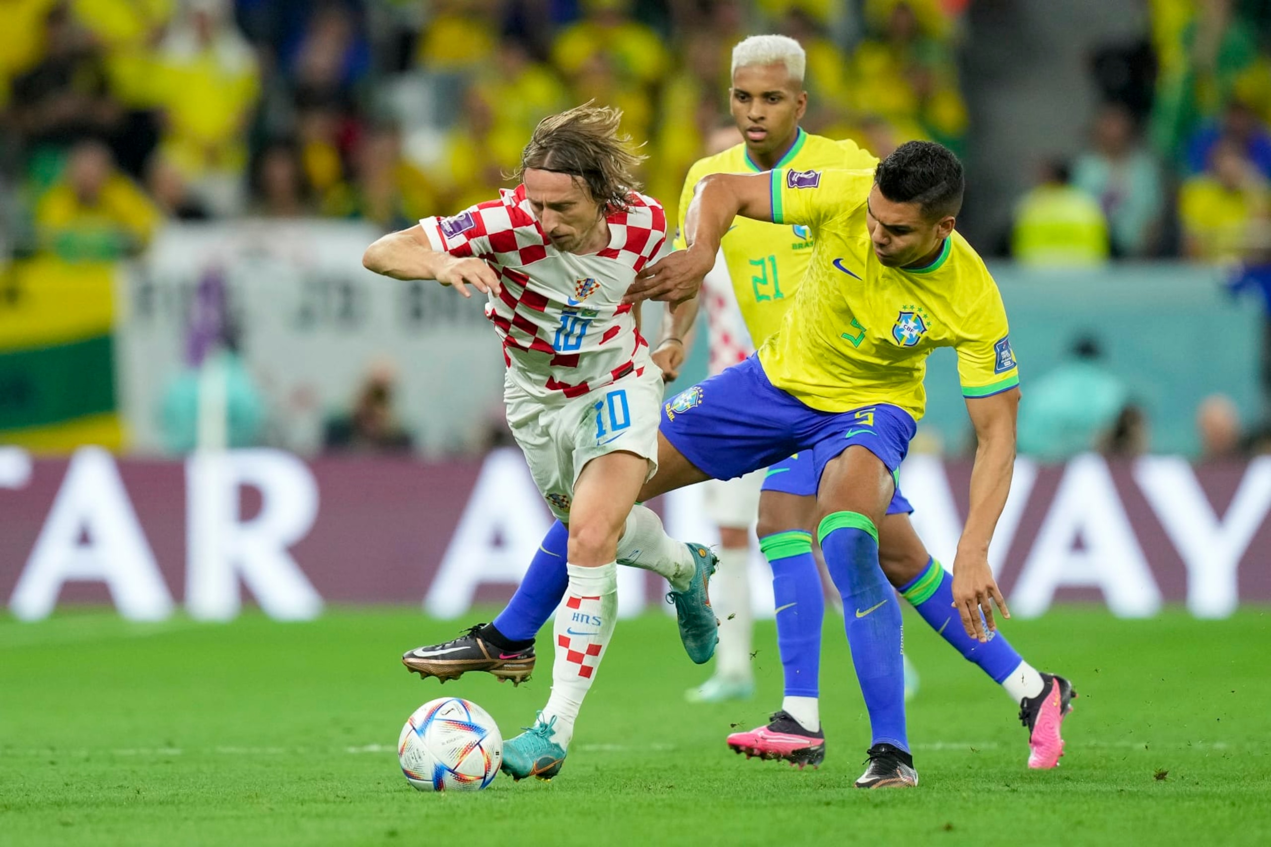 AL RAYYAN, QATAR - DECEMBER 09: Luka Modric of Croatia and Casemiro of Brazil battle for the ball during the FIFA World Cup Qatar 2022 quarter final match between Croatia and Brazil at Education City Stadium on December 9, 2022 in Al Rayyan, Qatar. (Photo by Mohammad Karamali/DeFodi Images via Getty Images) AL RAYYAN, QATAR - DECEMBER 09: Luka Modric of Croatia and Casemiro of Brazil battle for the ball during the FIFA World Cup Qatar 2022 quarter final match between Croatia and Brazil at Education City Stadium on December 9, 2022 in Al Rayyan, Qatar. (Photo by Mohammad Karamali/DeFodi Images via Getty Images)