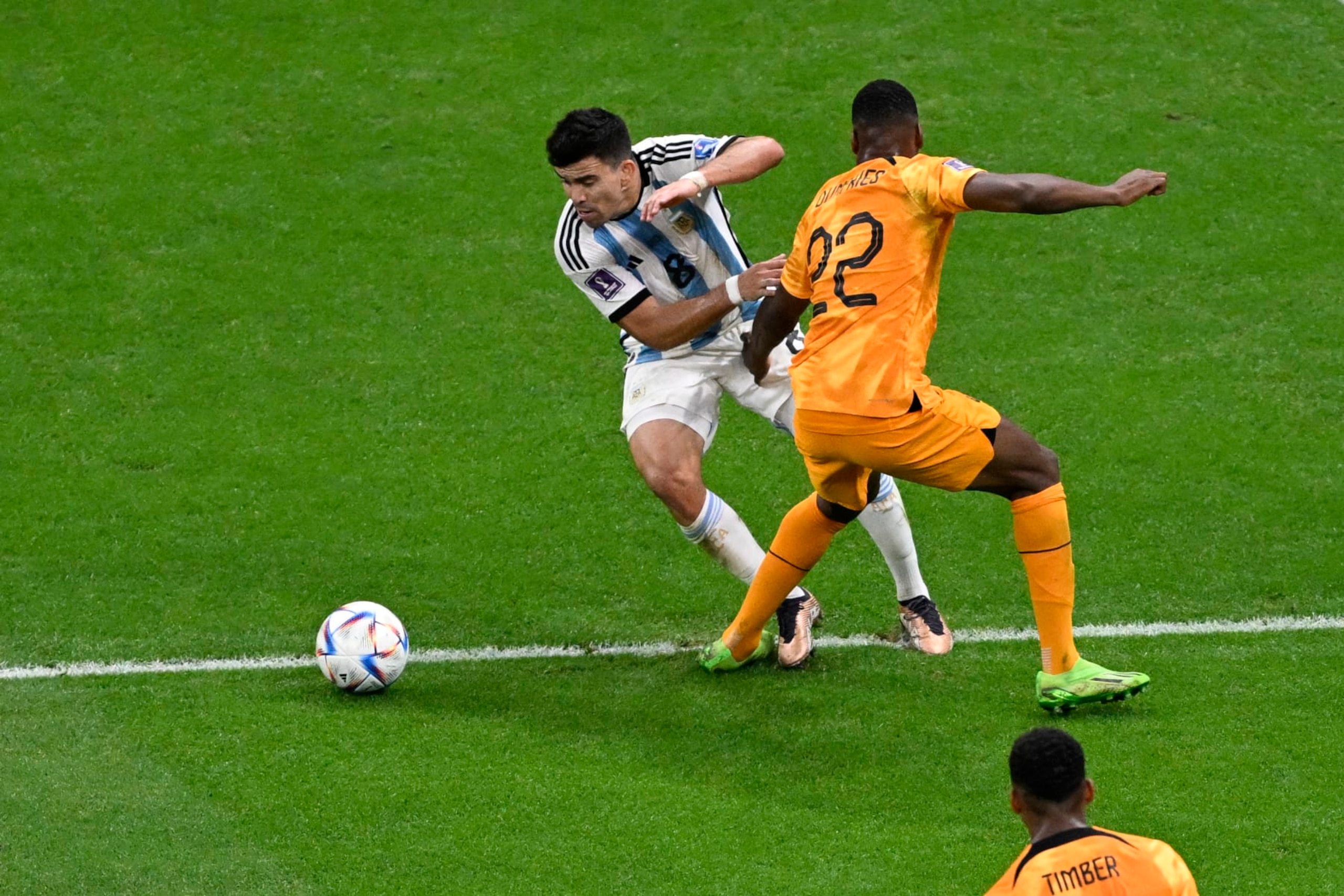 Argentina's defender #08 Marcos Acuna (L) fights for the ball with Netherlands' defender #22 Denzel Dumfries during the Qatar 2022 World Cup quarter-final football match between The Netherlands and Argentina at Lusail Stadium, north of Doha on December 9, 2022. (Photo by PATRICIA DE MELO MOREIRA / AFP) (Photo by PATRICIA DE MELO MOREIRA/AFP via Getty Images) Argentina's defender #08 Marcos Acuna (L) fights for the ball with Netherlands' defender #22 Denzel Dumfries during the Qatar 2022 World Cup quarter-final football match between The Netherlands and Argentina at Lusail Stadium, north of Doha on December 9, 2022. (Photo by PATRICIA DE MELO MOREIRA / AFP) (Photo by PATRICIA DE MELO MOREIRA/AFP via Getty Images)