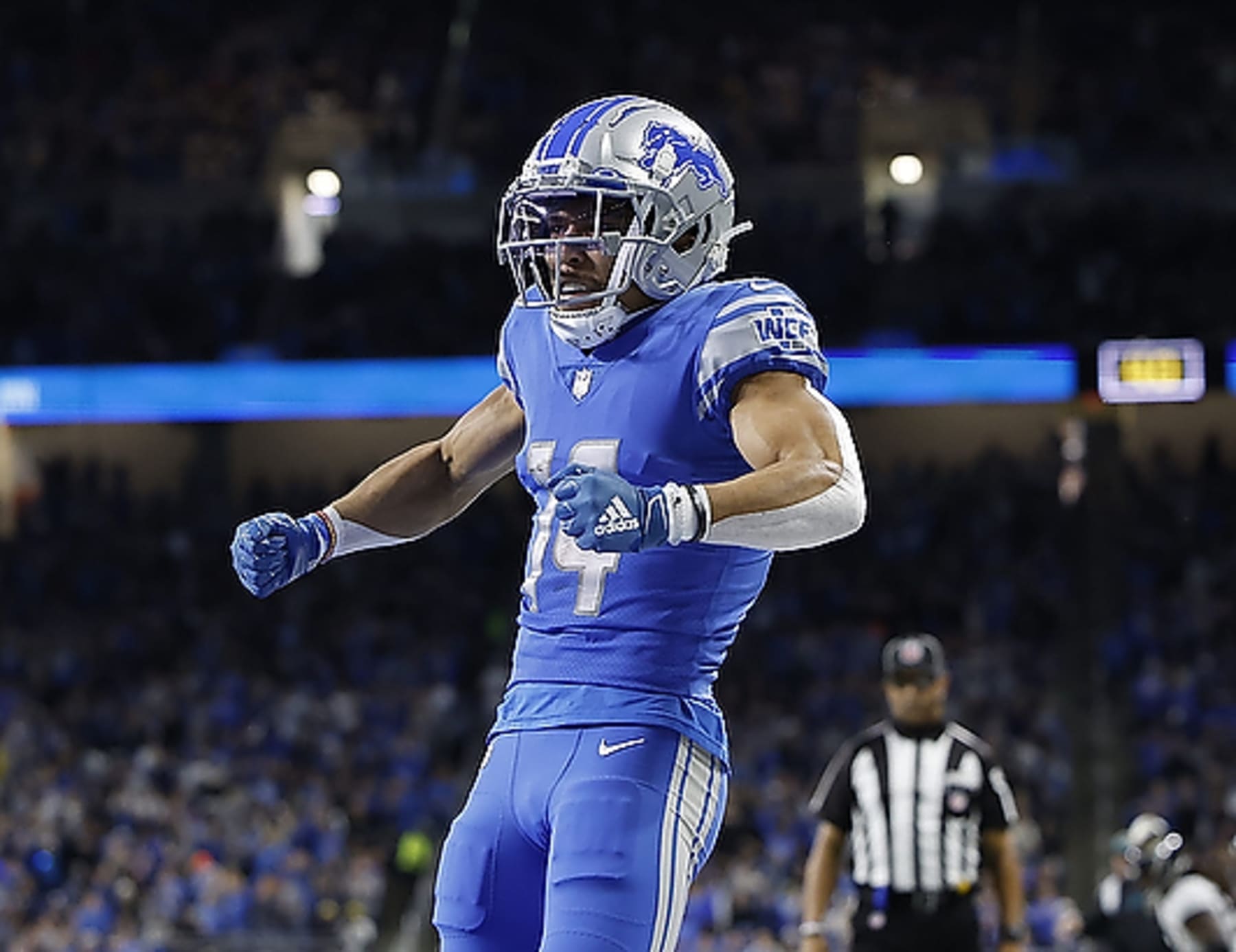 DETROIT, MI - DECEMBER 4: Amon-Ra St. Brown #14 of the Detroit Lions celebrates a touchdown during the game against the Jacksonville Jaguars at Ford Field on December 4, 2022 in Detroit, Michigan. Detroit defeated Jacksonville 40-14. (Photo by Leon Halip/Getty Images)