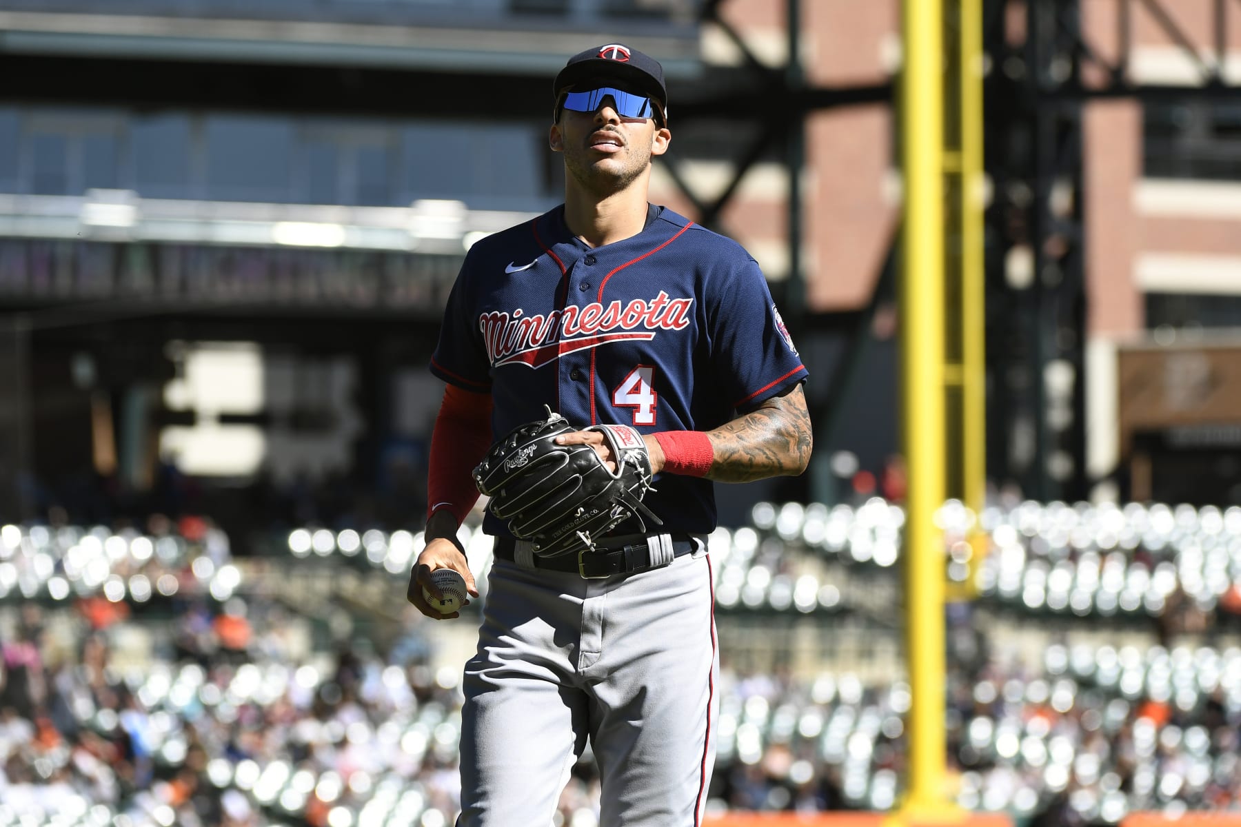 Minnesota Twins shortstop Carlos Correa jogs to the dugout at the end of the seventh inning of a baseball game against the Detroit Tigers, Sunday, Oct. 2, 2022, in Detroit. (AP Photo/Jose Juarez)