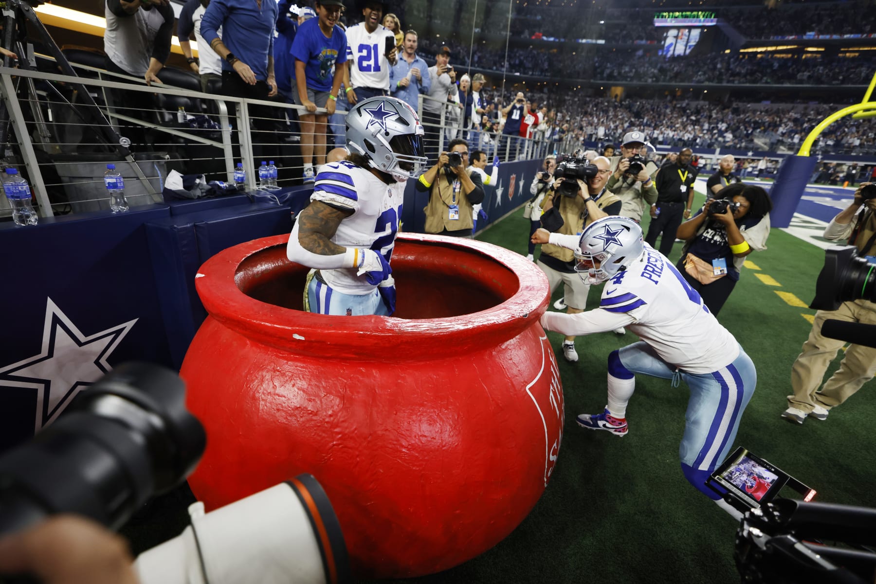 ARLINGTON, TEXAS - DECEMBER 04: Ezekiel Elliott #21 celebrates a touchdown with Dak Prescott #4 of the Dallas Cowboys in the fourth quarter of a game against the Indianapolis Colts at AT&T Stadium on December 04, 2022 in Arlington, Texas. (Photo by Wesley Hitt/Getty Images)