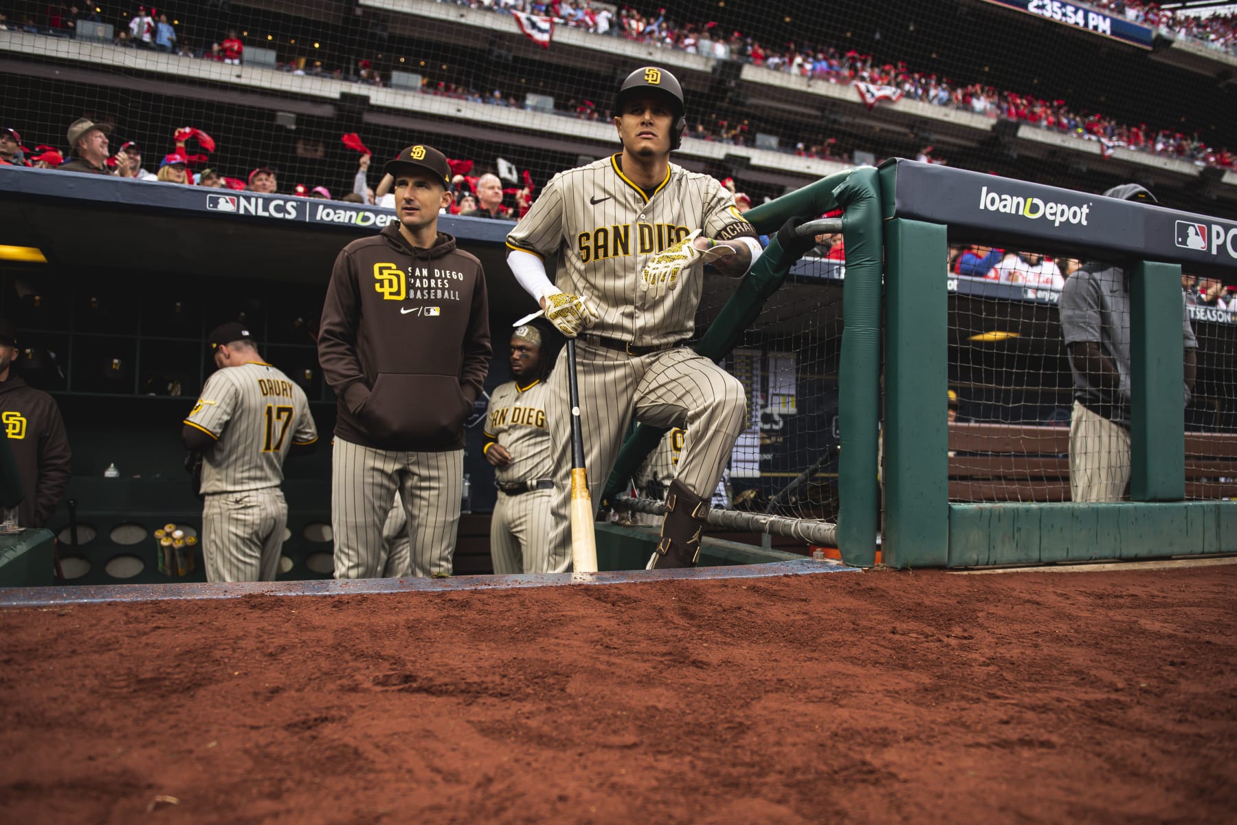 PHILADELPHIA, PENNSYLVANIA - OCTOBER 23: Manny Machado #13 of the San Diego Padres stands in the dugout before the start of Game Five of the National League Championship Series against the Philadelphia Phillies at Citizens Bank Park on October 23, 2022 in Philadelphia, Pennsylvania. (Photo by Matt Thomas/San Diego Padres/Getty Images)