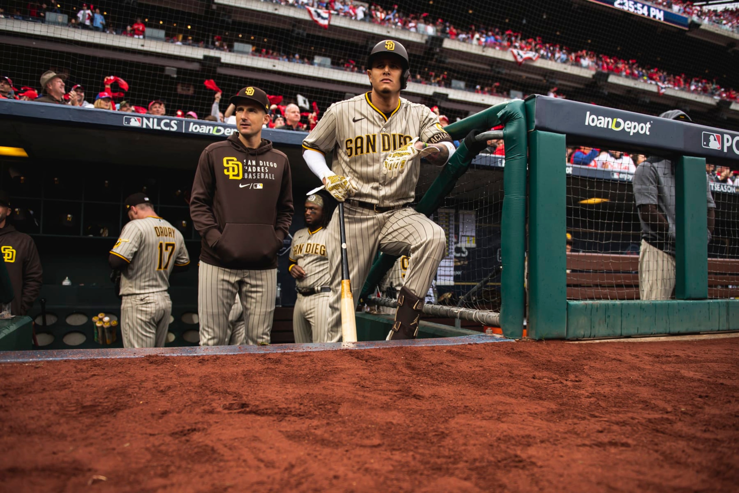 PHILADELPHIA, PENNSYLVANIA - OCTOBER 23: Manny Machado #13 of the San Diego Padres stands in the dugout before the start of Game Five of the National League Championship Series against the Philadelphia Phillies at Citizens Bank Park on October 23, 2022 in Philadelphia, Pennsylvania. (Photo by Matt Thomas/San Diego Padres/Getty Images) PHILADELPHIA, PENNSYLVANIA - OCTOBER 23: Manny Machado #13 of the San Diego Padres stands in the dugout before the start of Game Five of the National League Championship Series against the Philadelphia Phillies at Citizens Bank Park on October 23, 2022 in Philadelphia, Pennsylvania. (Photo by Matt Thomas/San Diego Padres/Getty Images)