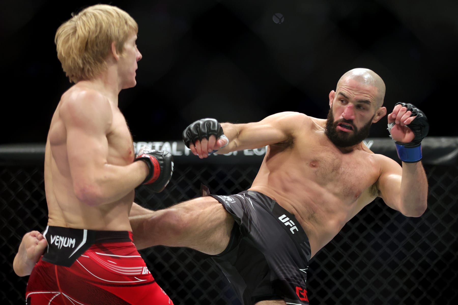 LAS VEGAS, NEVADA - DECEMBER 10: (R-L) Jared Gordon kicks Paddy Pimblett of England in a lightweight fight during the UFC 282 event at T-Mobile Arena on December 10, 2022 in Las Vegas, Nevada. (Photo by Carmen Mandato/Zuffa LLC)