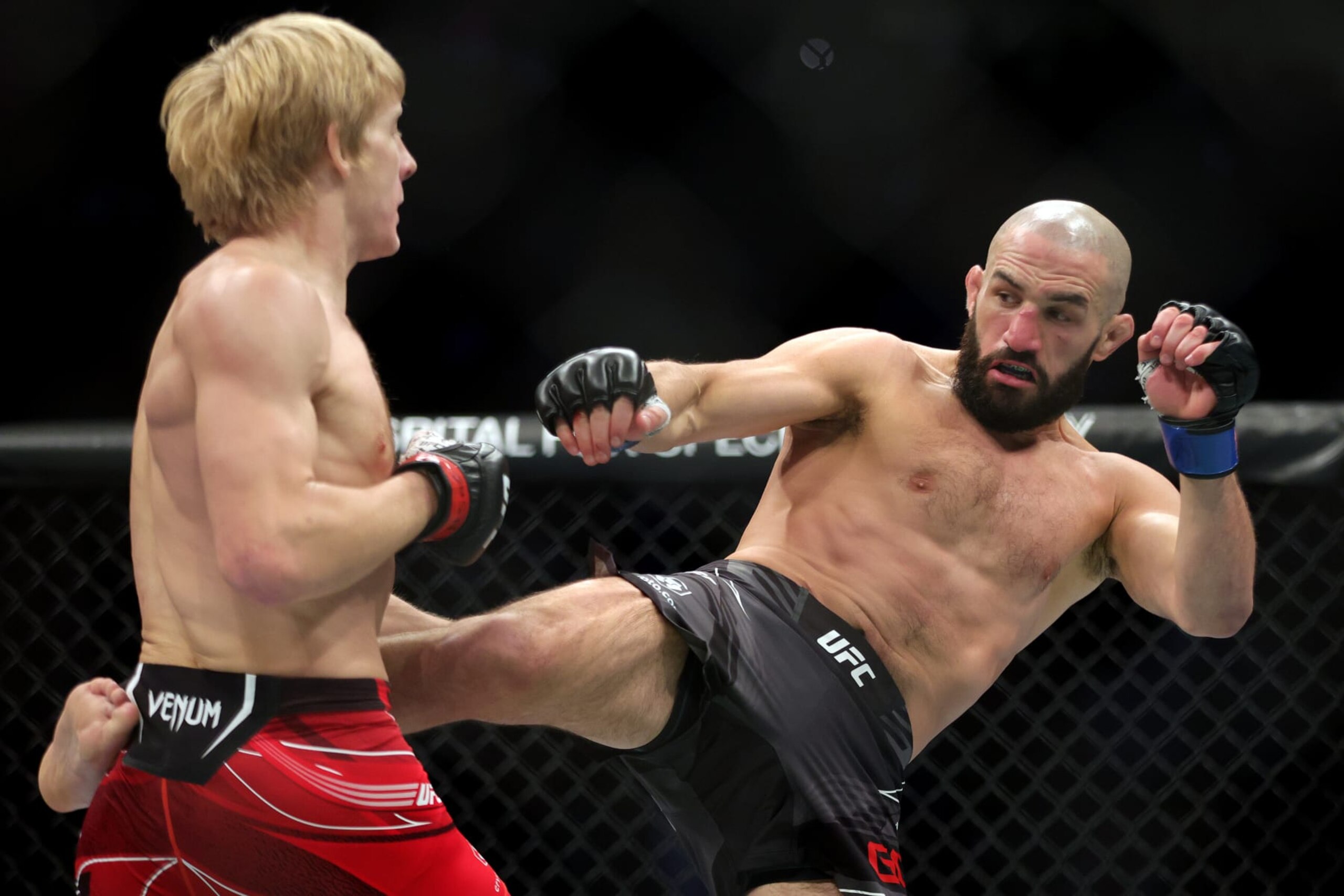 LAS VEGAS, NEVADA - DECEMBER 10: (R-L) Jared Gordon kicks Paddy Pimblett of England in a lightweight fight during the UFC 282 event at T-Mobile Arena on December 10, 2022 in Las Vegas, Nevada. (Photo by Carmen Mandato/Zuffa LLC)