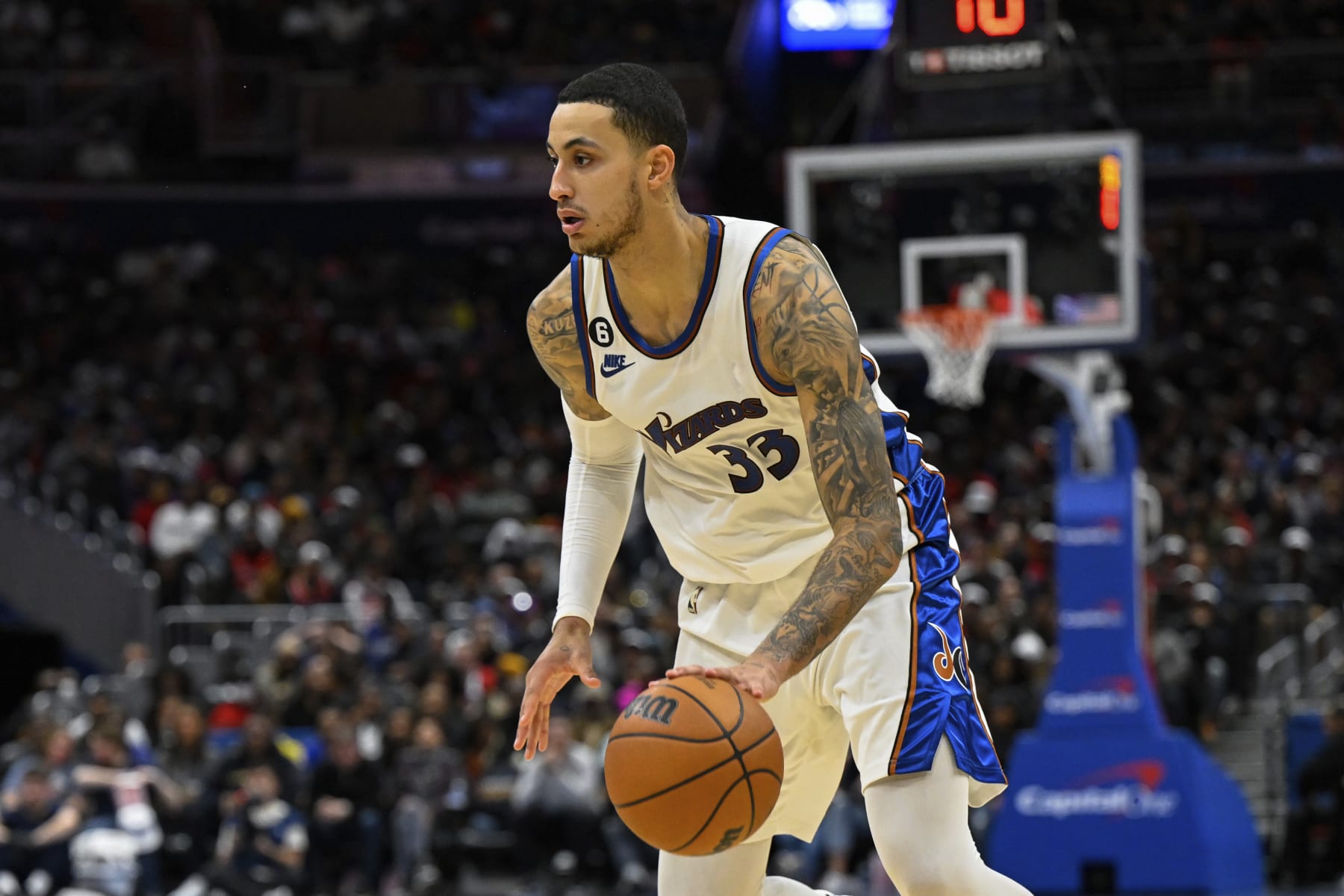 Washington Wizards forward Kyle Kuzma (33) handles the ball during the second half of an NBA basketball game against the Los Angeles Clippers, Saturday, Dec. 10, 2022, in Washington. (AP Photo/Terrance Williams)